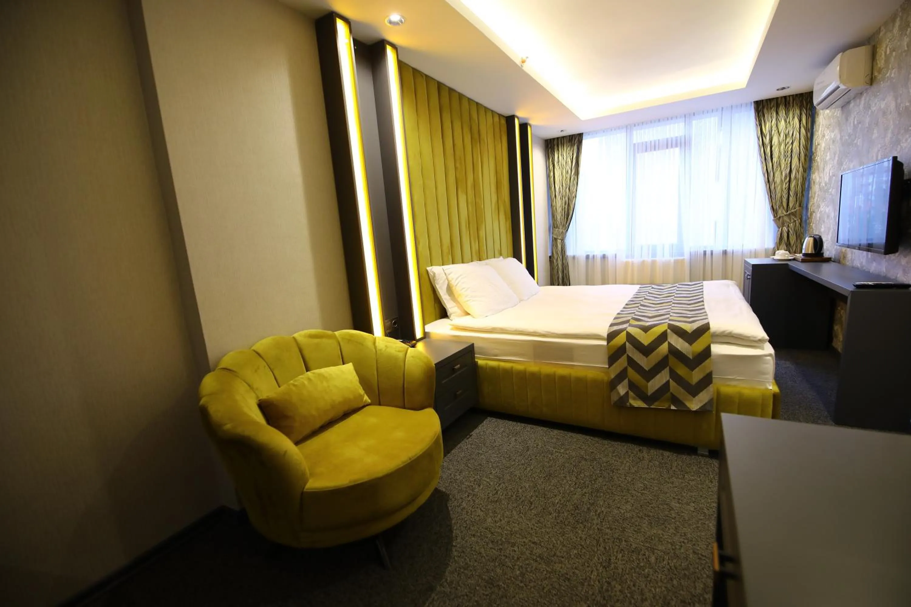 Bed in GRAND DORA HOTEL