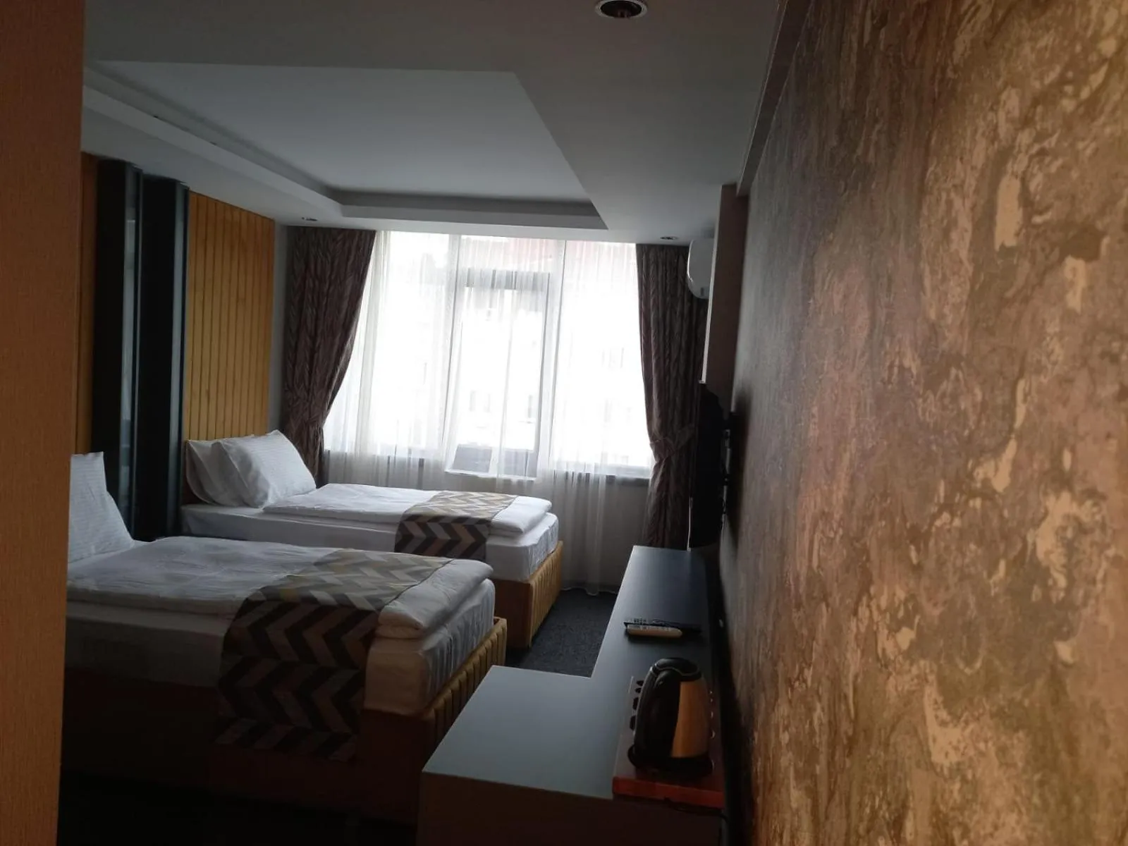 Bed in GRAND DORA HOTEL