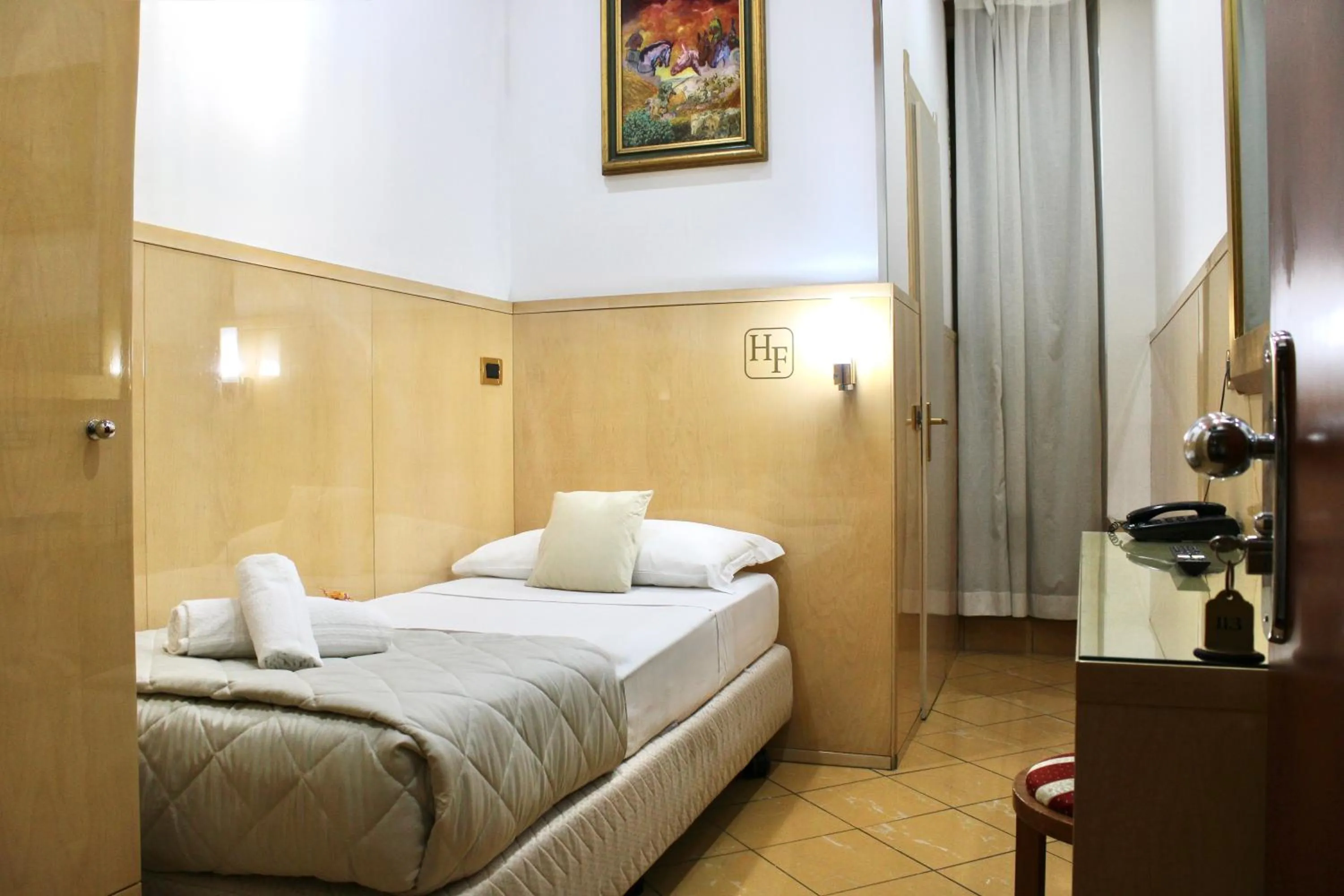 Photo of the whole room, Bed in Hotel Fiorella Milano