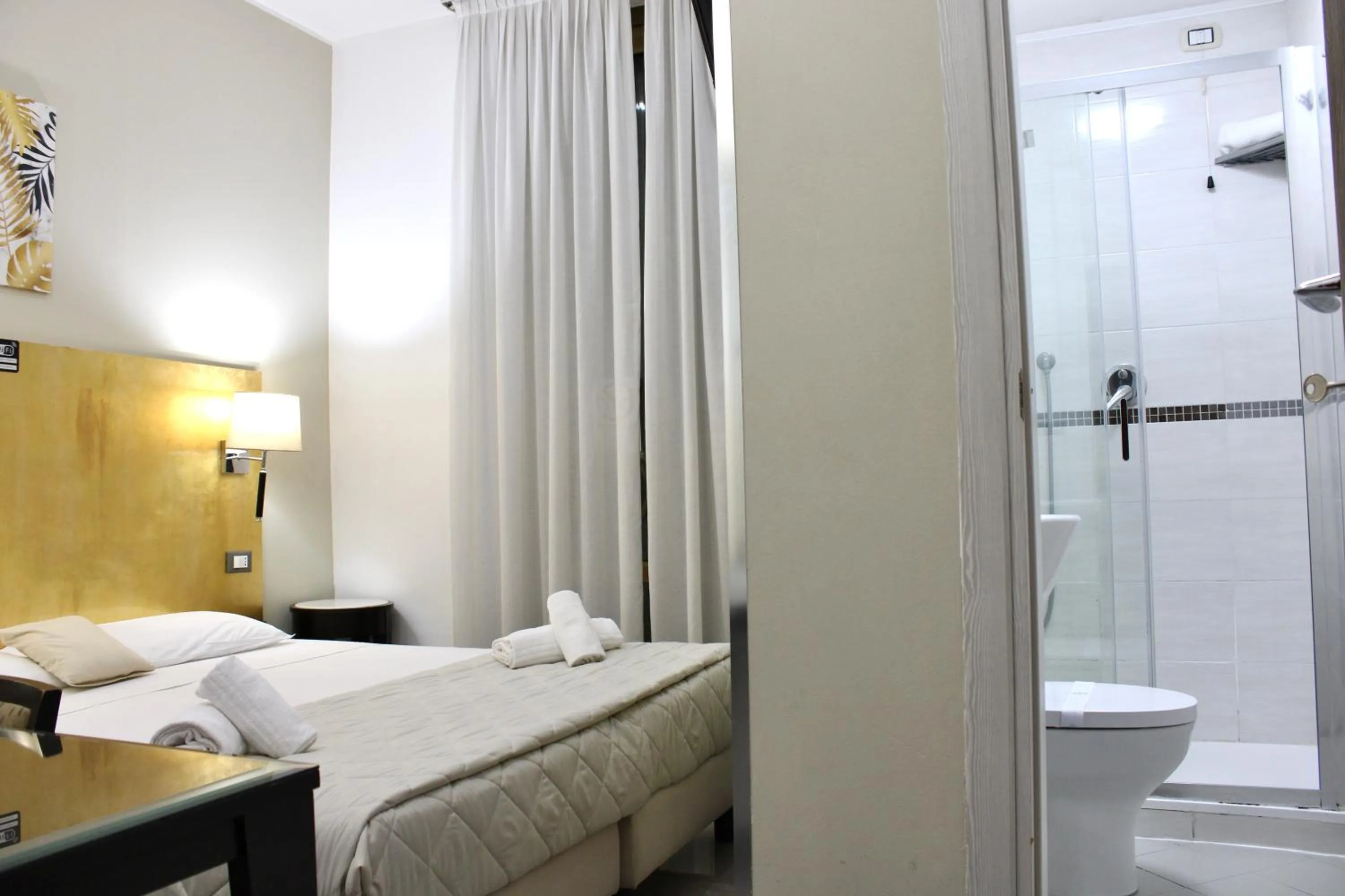 Photo of the whole room, Bed in Hotel Fiorella Milano