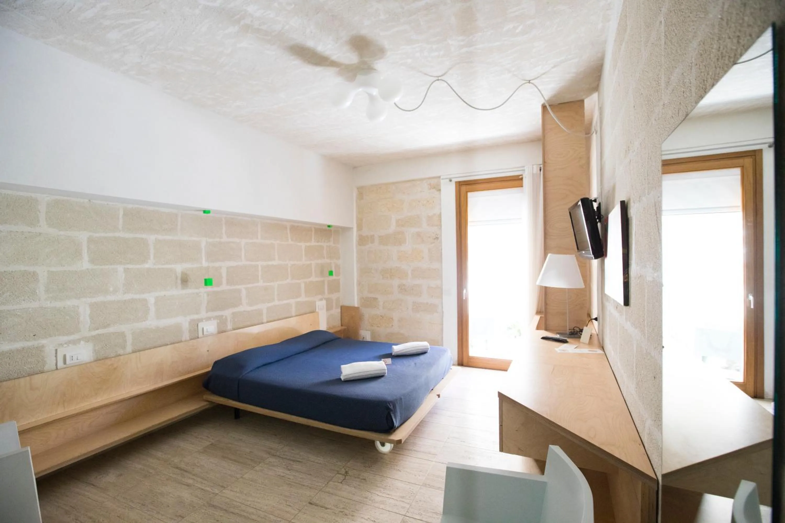 Bed in Cave Bianche Hotel