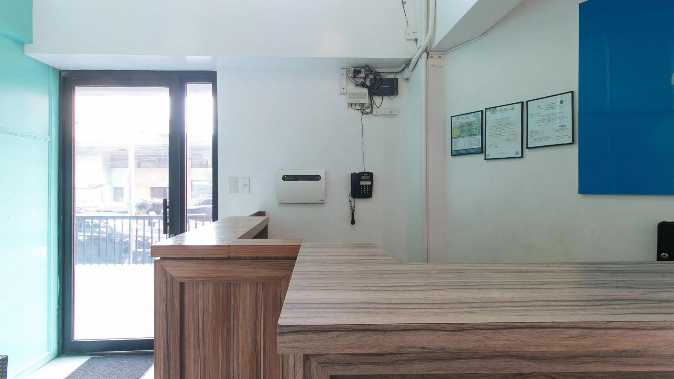 Lobby or reception in Filmore Suites Makati by RedDoorz