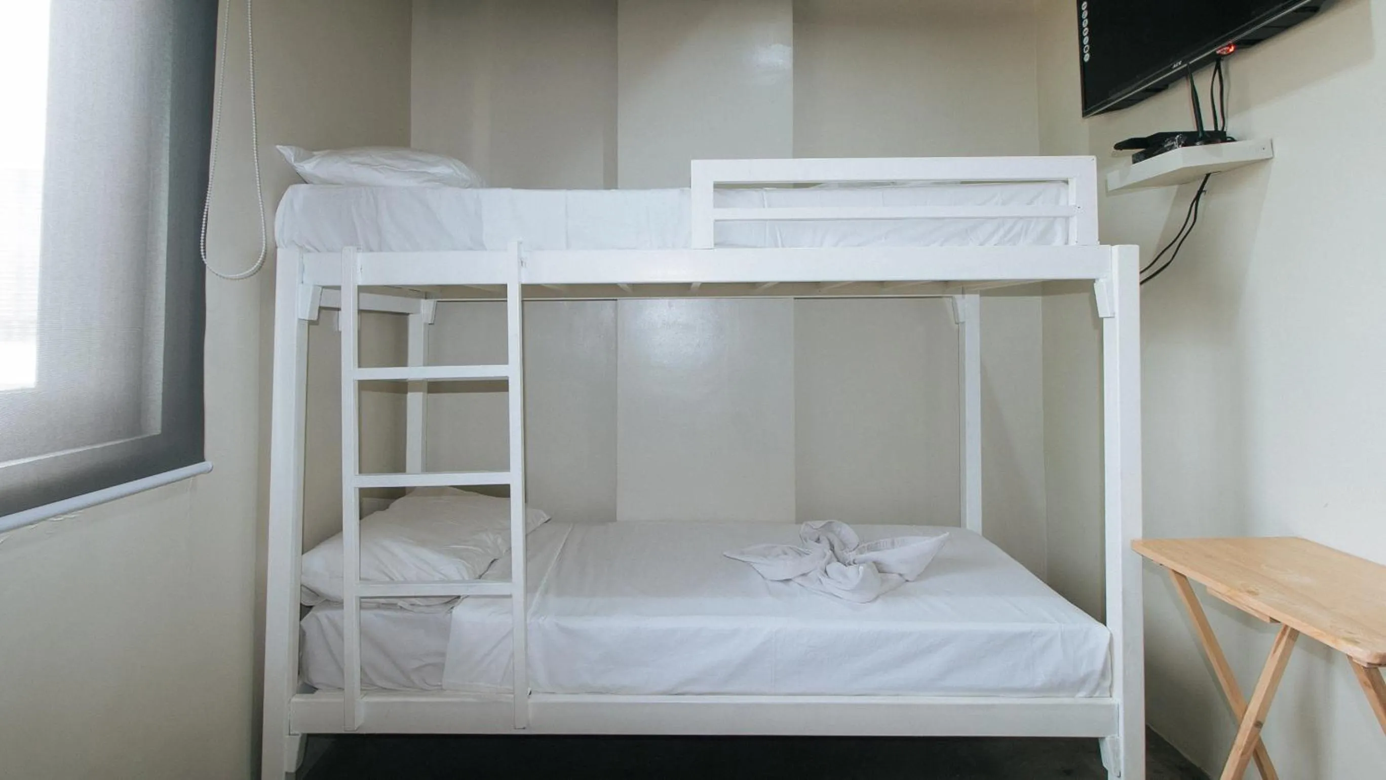 Photo of the whole room in Filmore Suites Makati by RedDoorz