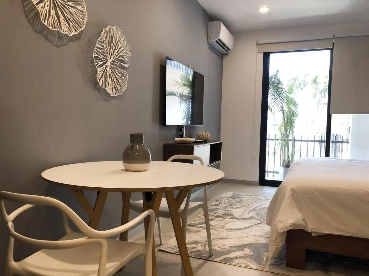 Bed in Deluxe Studio Aparment Mamitas Zone