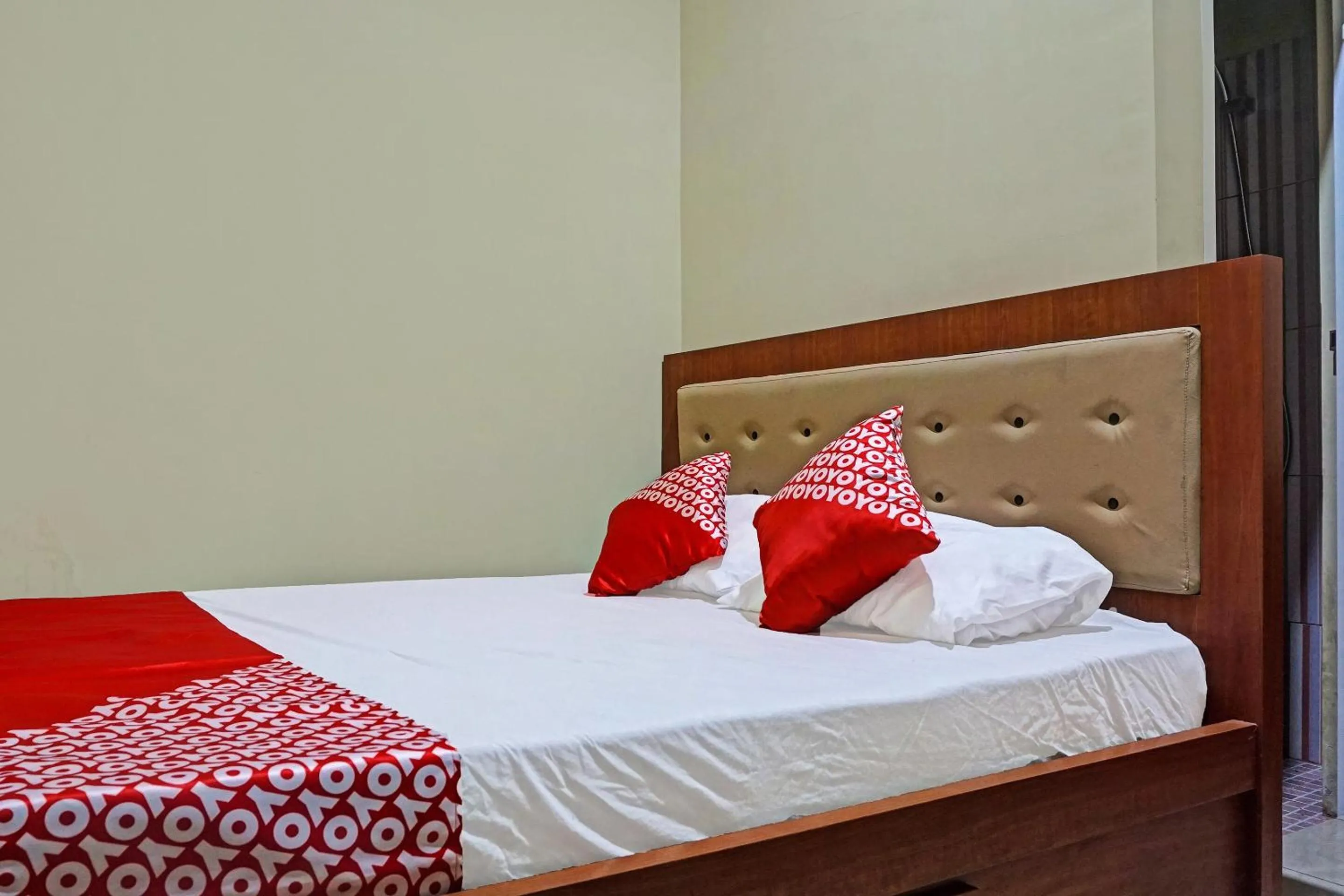 Bed in Hotel O Orange Homestay Makassar