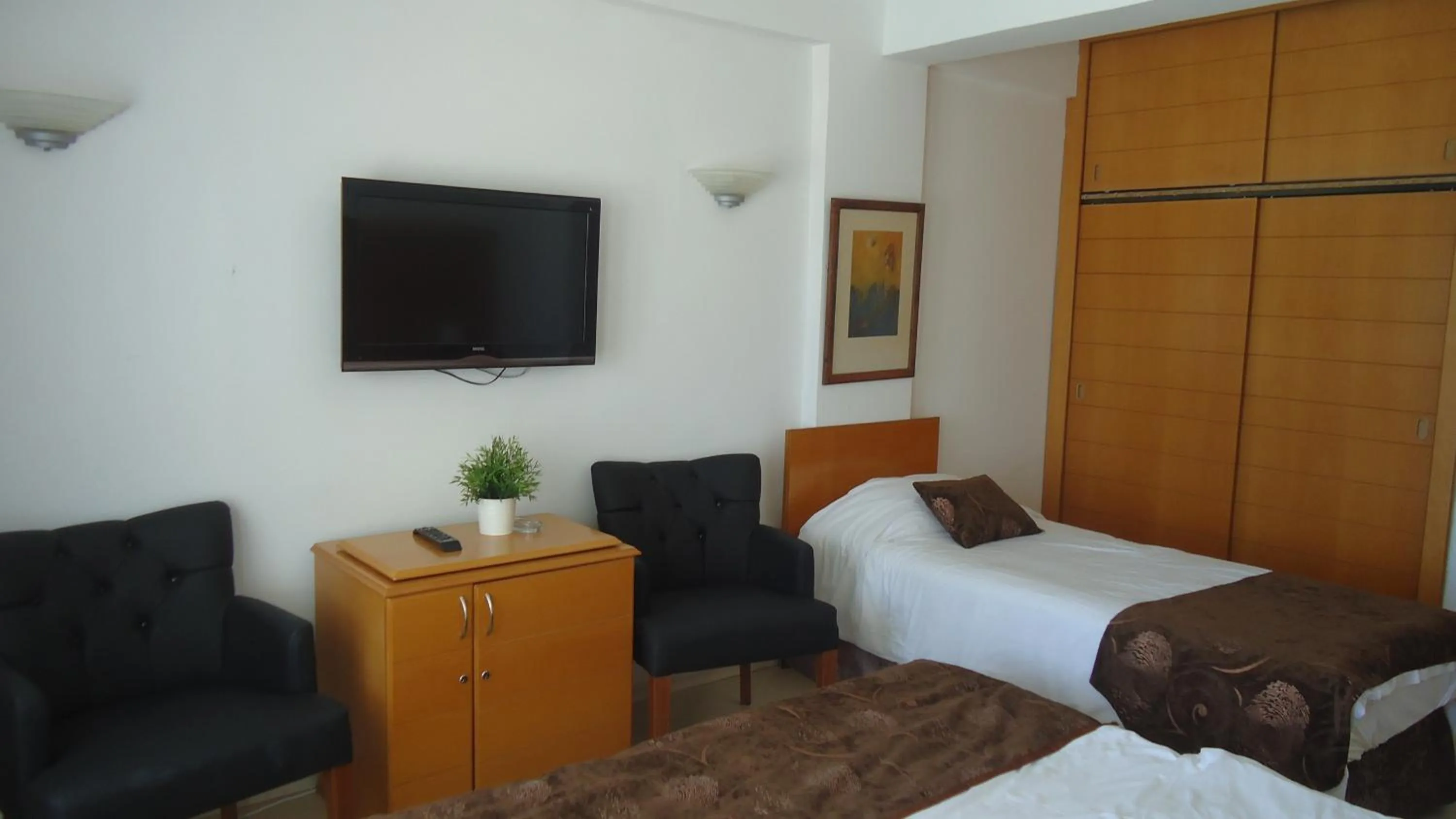 Living room, Bed in Ada Beach Hotel