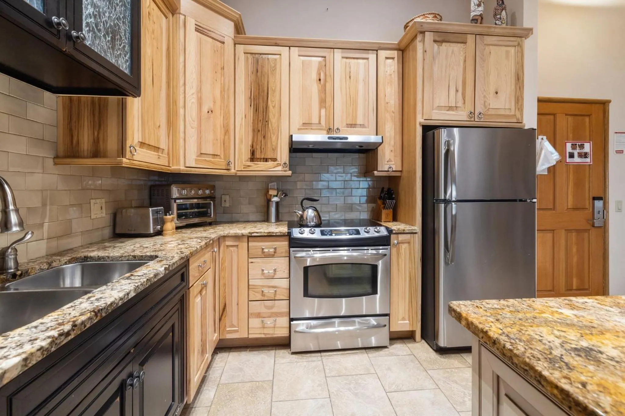 Communal kitchen in Jackpine & Black Bear Condos by Vail Resorts