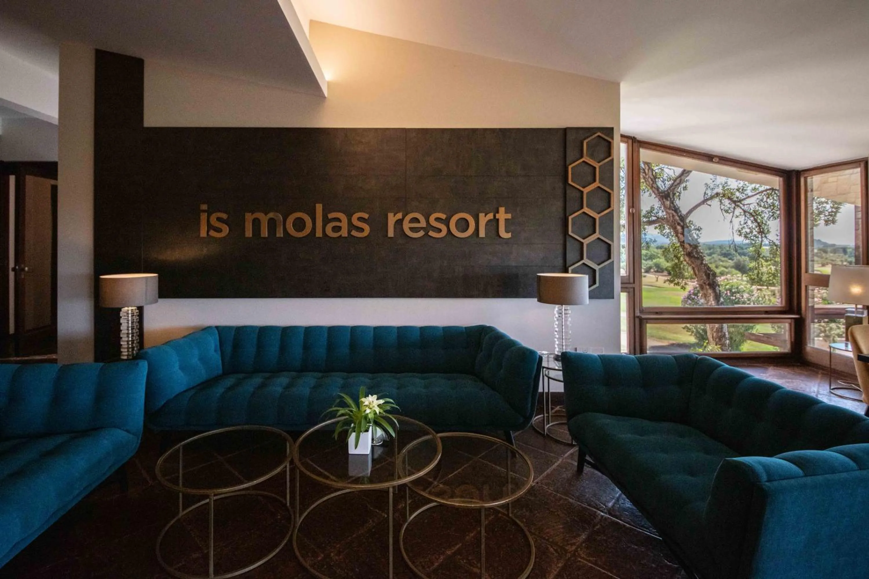Lounge or bar in Is Molas Resort