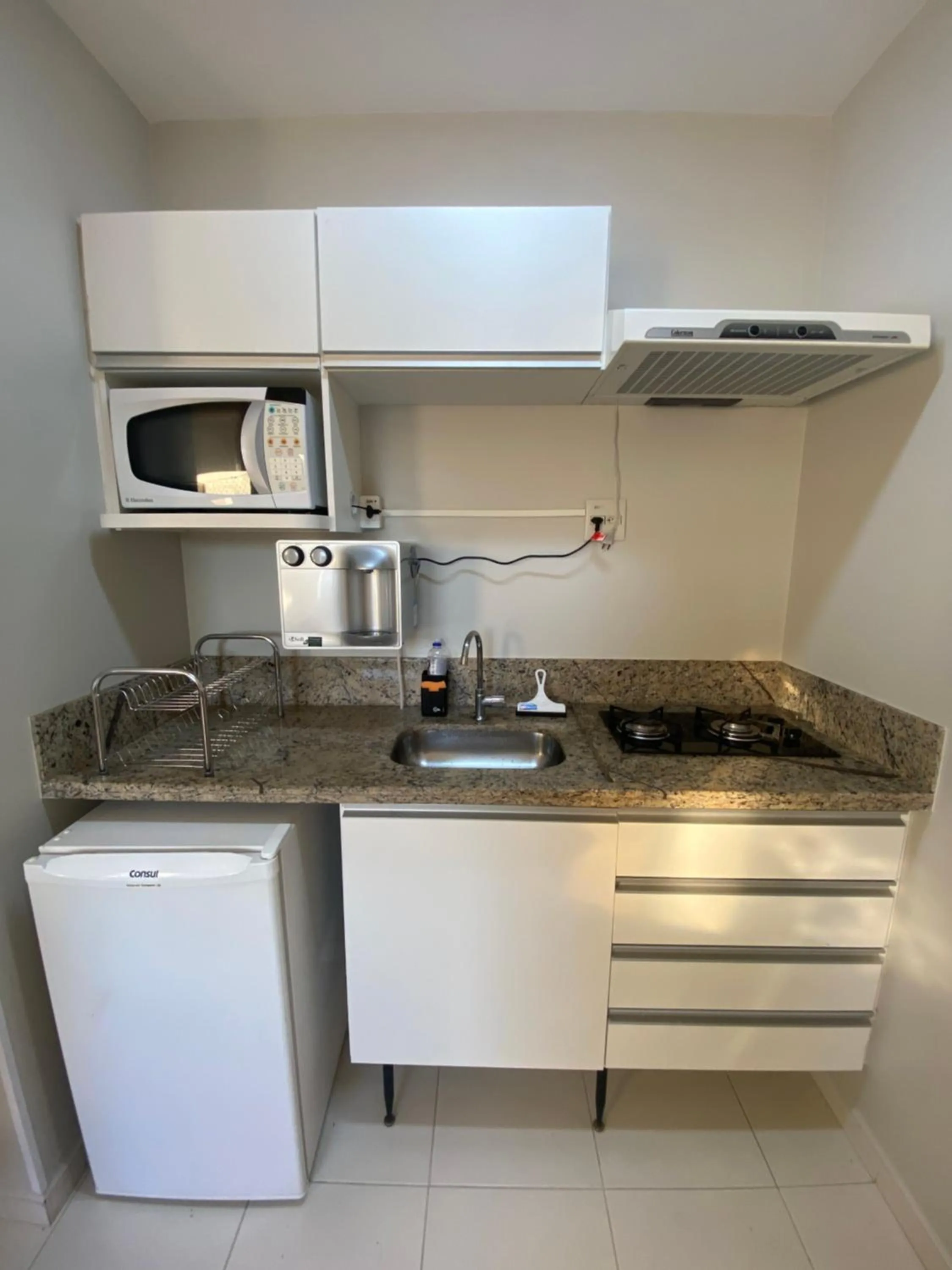 Kitchen or kitchenette in Prive Boulevard Suite Hotel