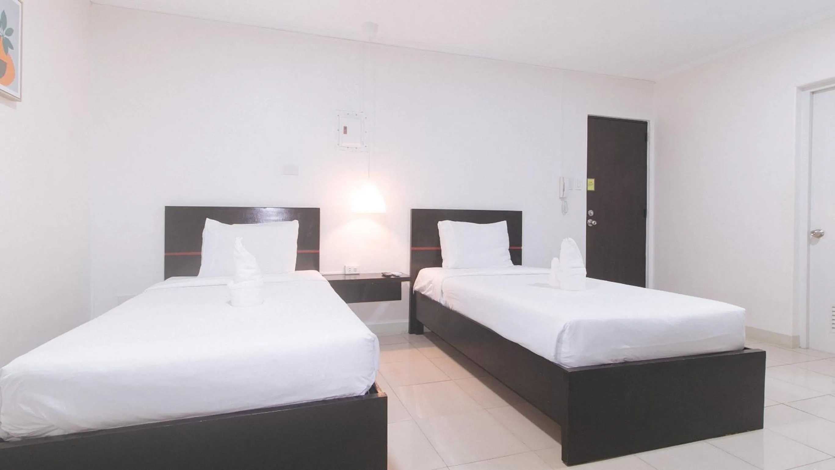 Bedroom, Bed in UrbanView at Evangelista Street Makati