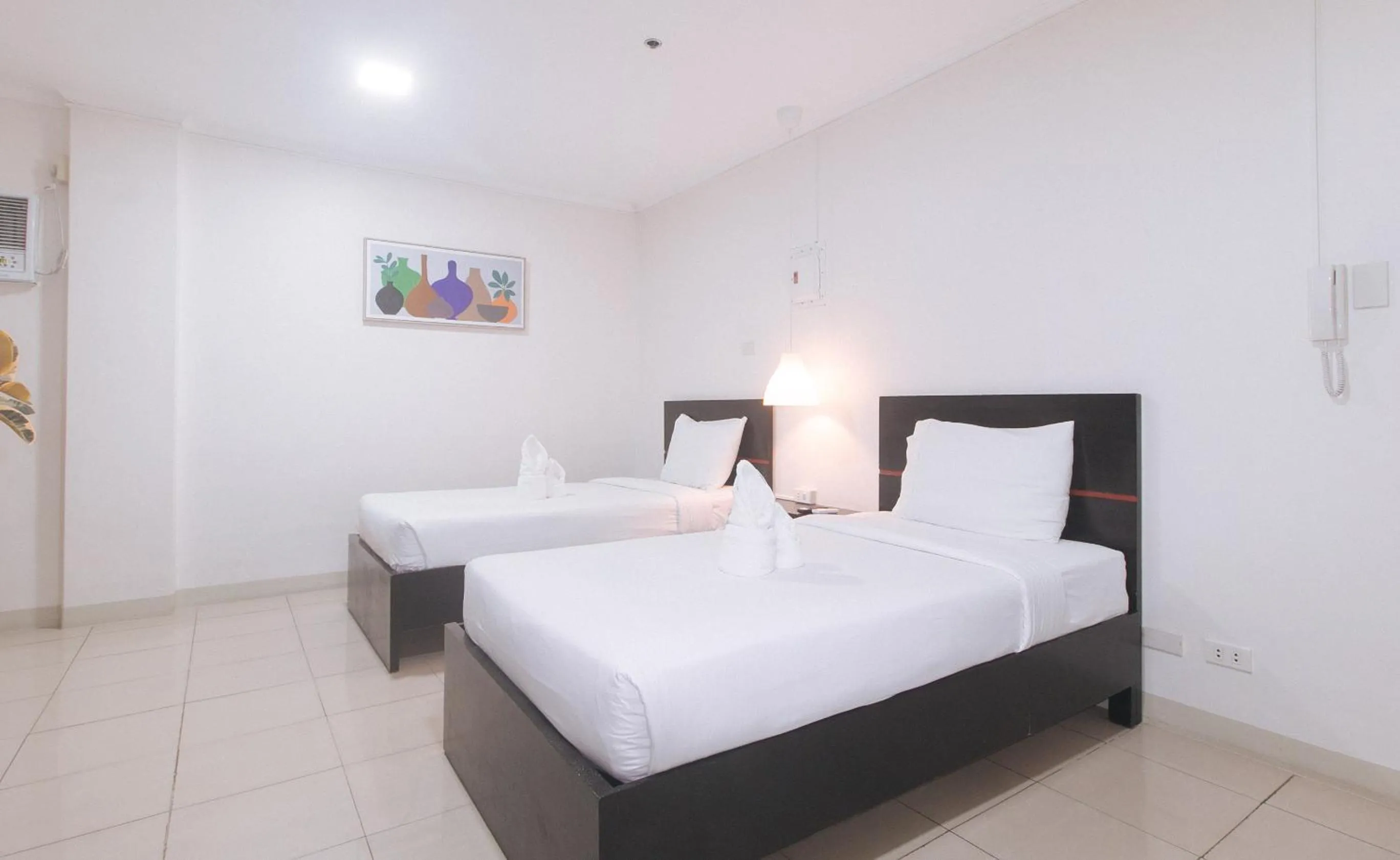 Photo of the whole room, Bed in UrbanView at Evangelista Street Makati