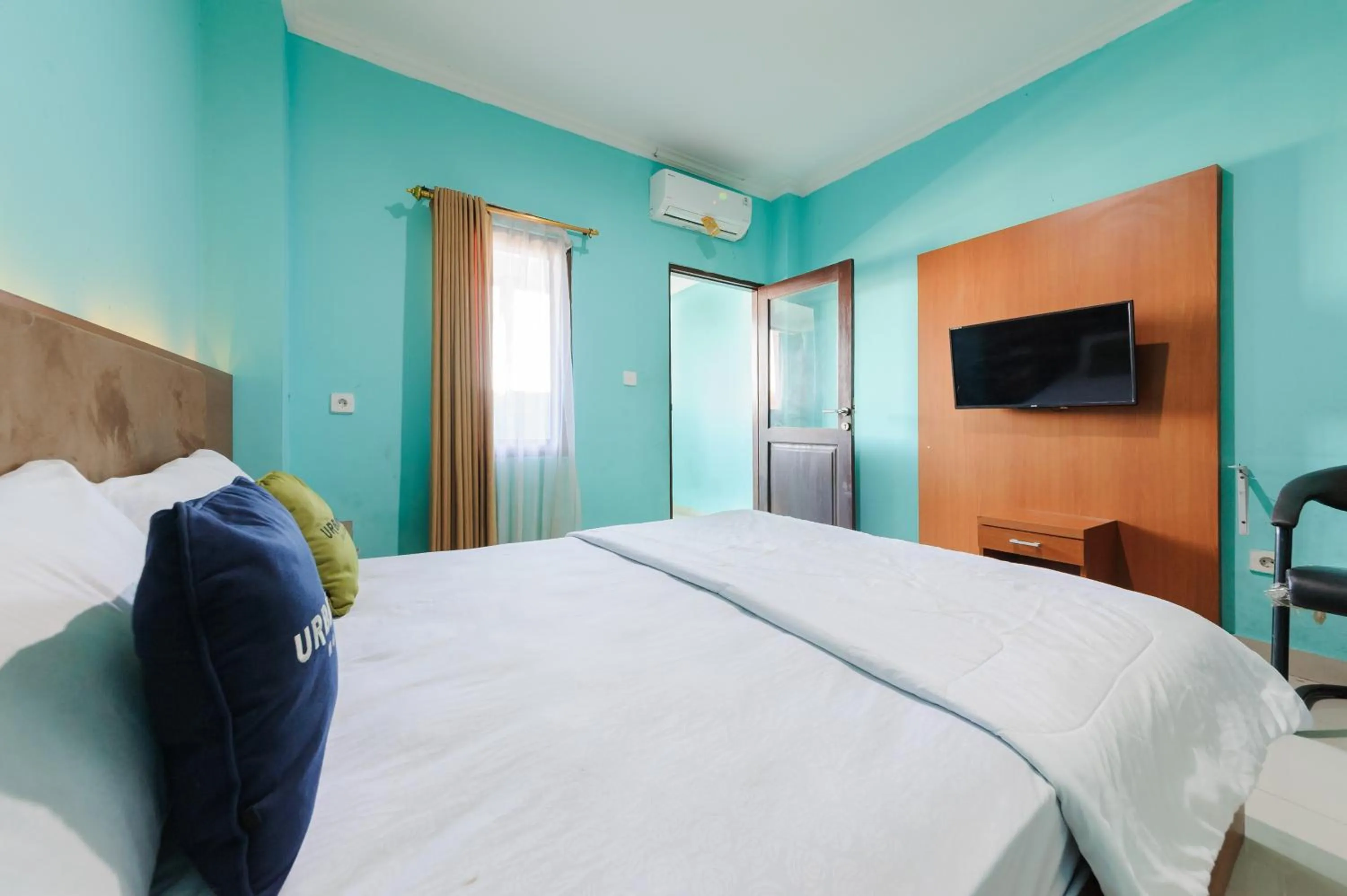 Bedroom, Bed in Gita Inn Bali RedPartner