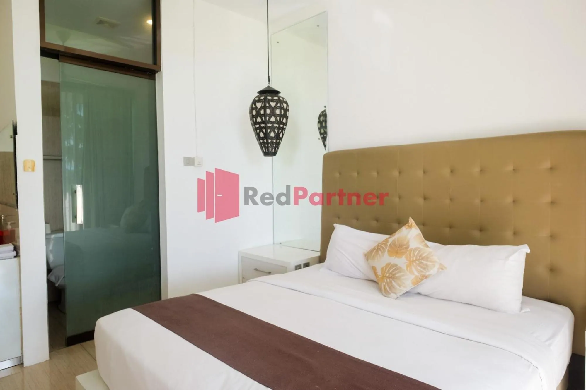 Bed in Sawah Joglo Boutique Villa Mitra RedDoorz