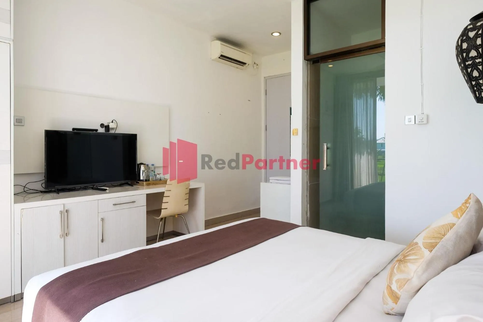 Bed in Sawah Joglo Boutique Villa Mitra RedDoorz