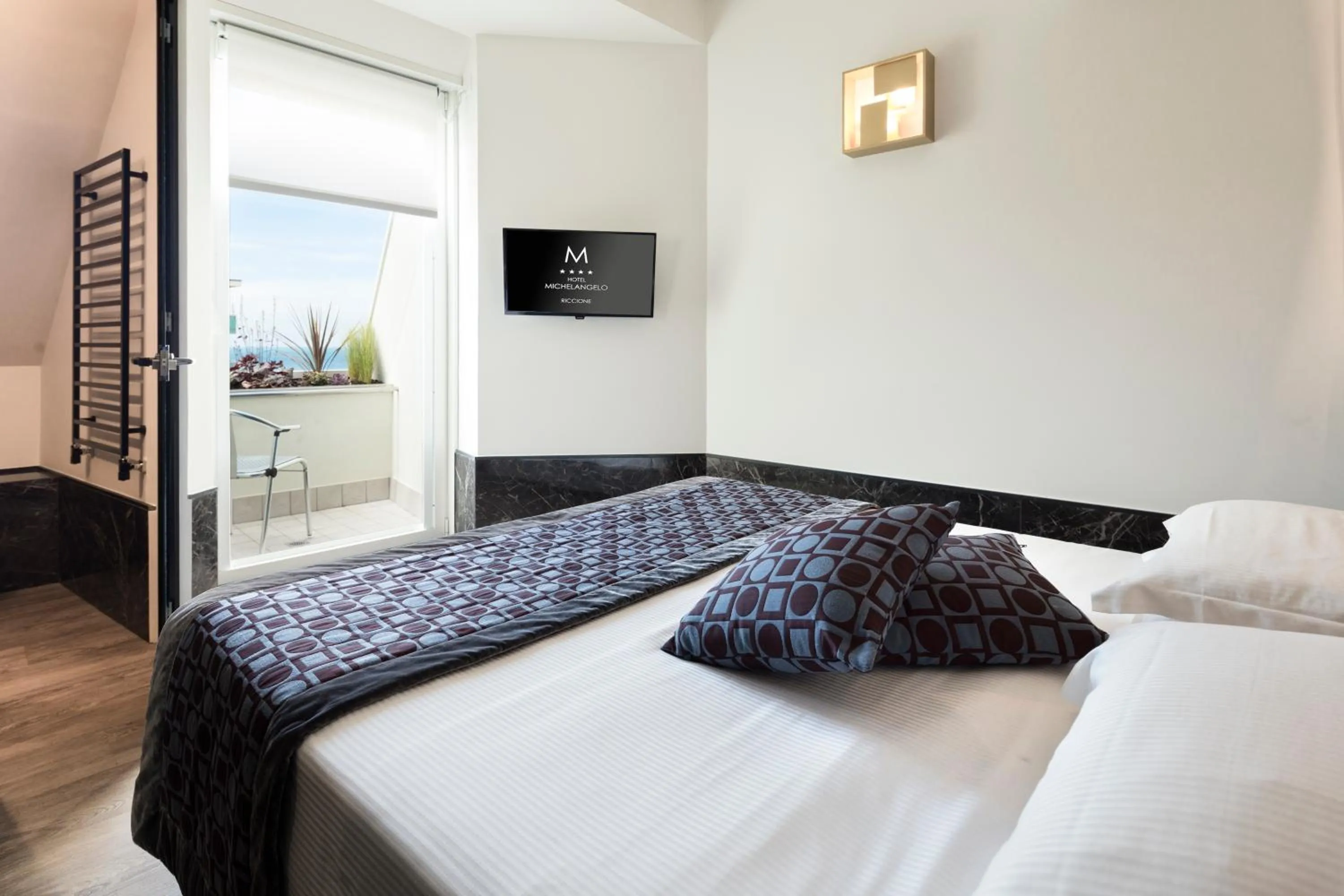 Bed in Hotel Michelangelo