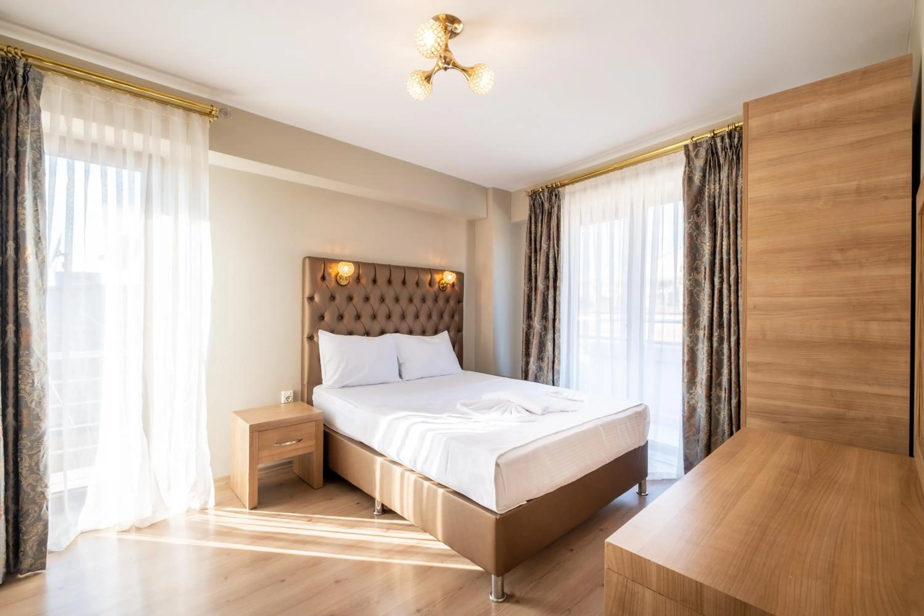 Bed in Lavin Hotel & Suites