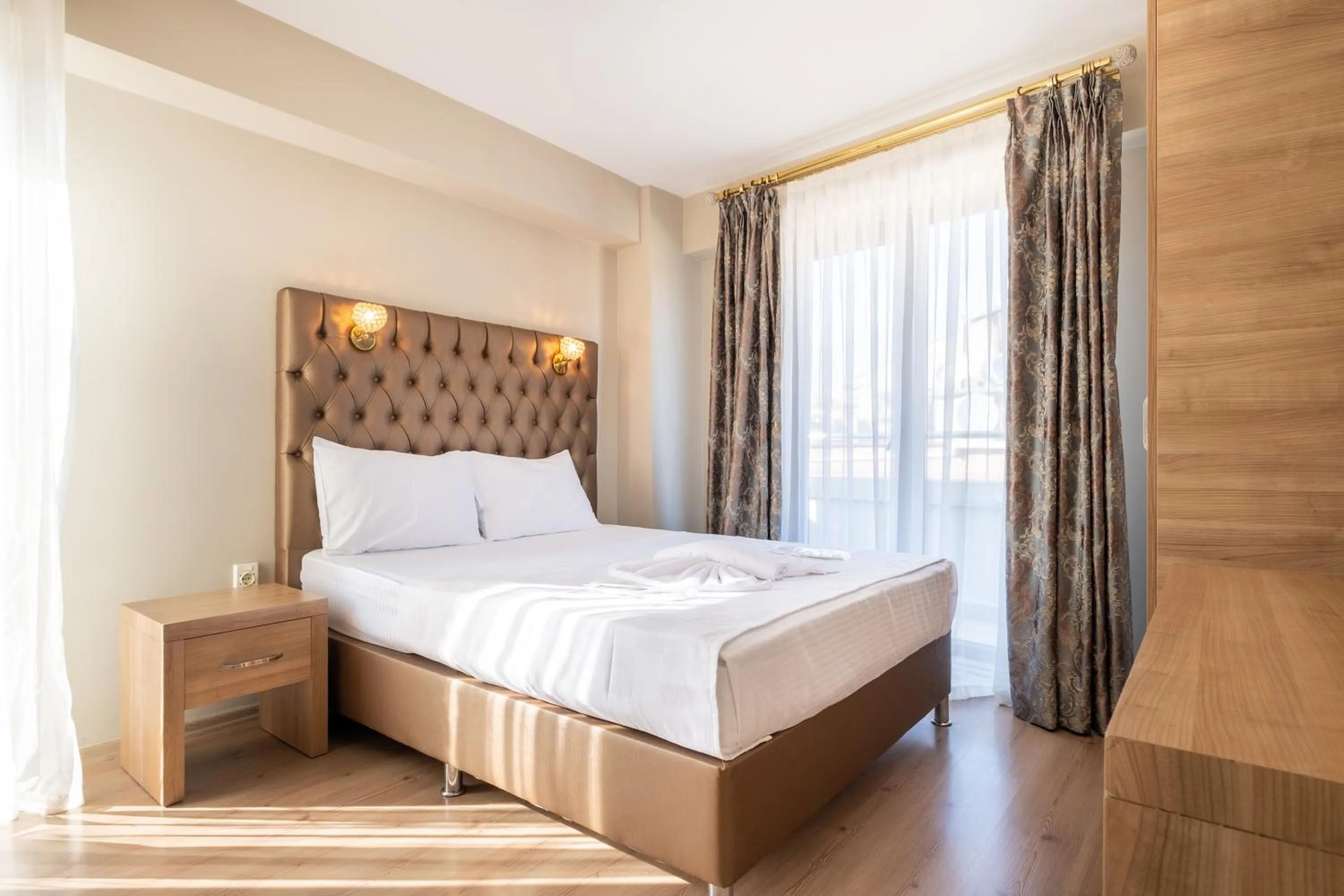 Bed in Lavin Hotel & Suites