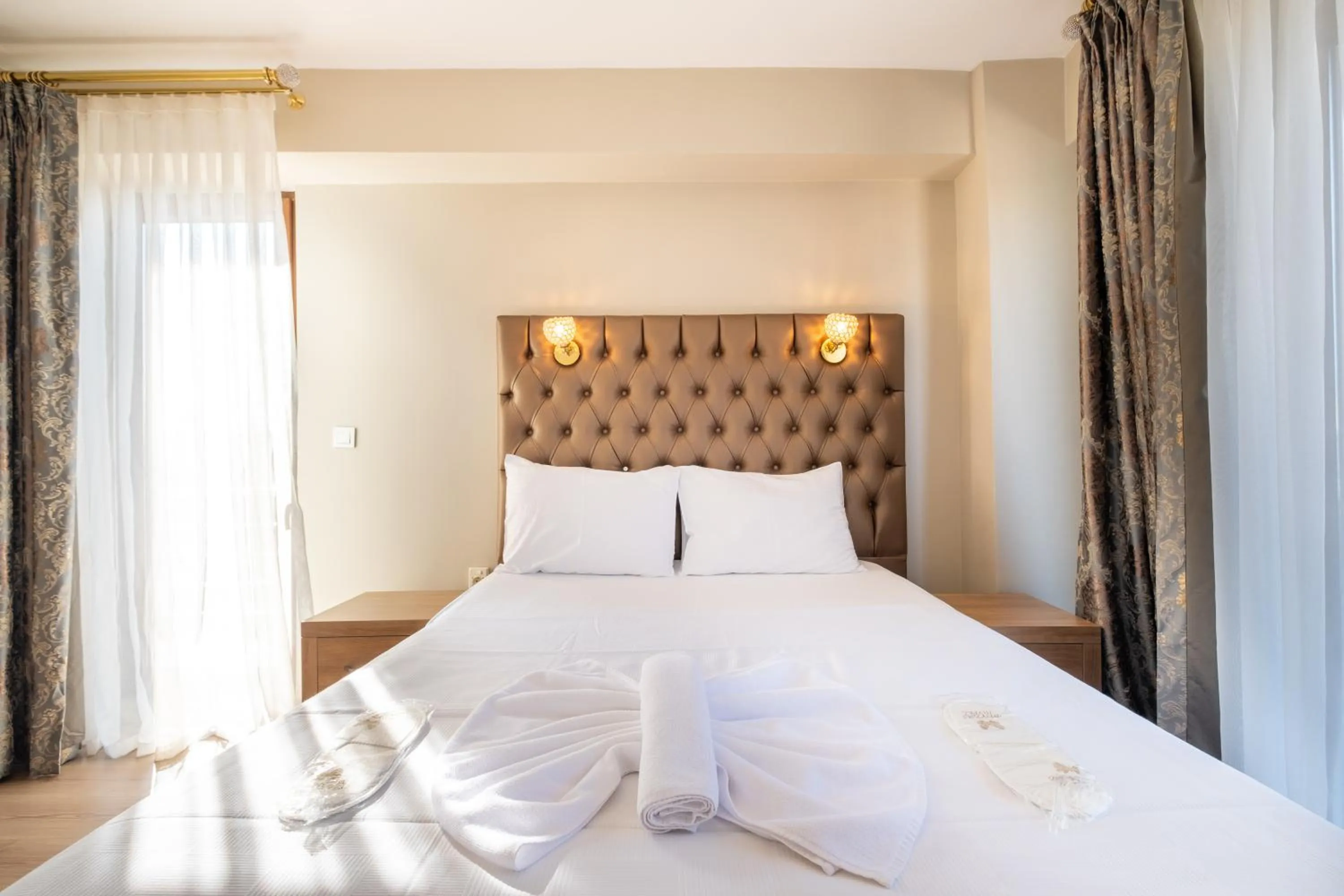 Bed in Lavin Hotel & Suites