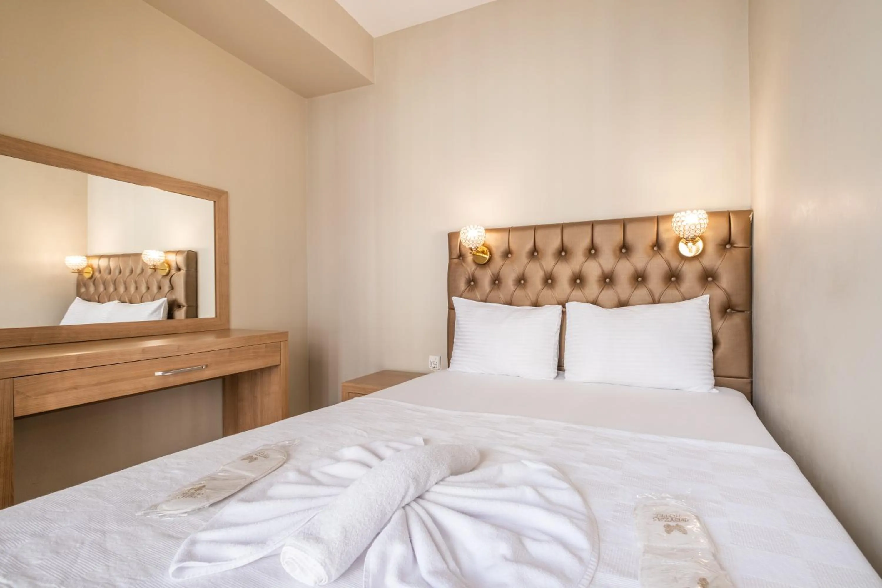 Bed in Lavin Hotel & Suites