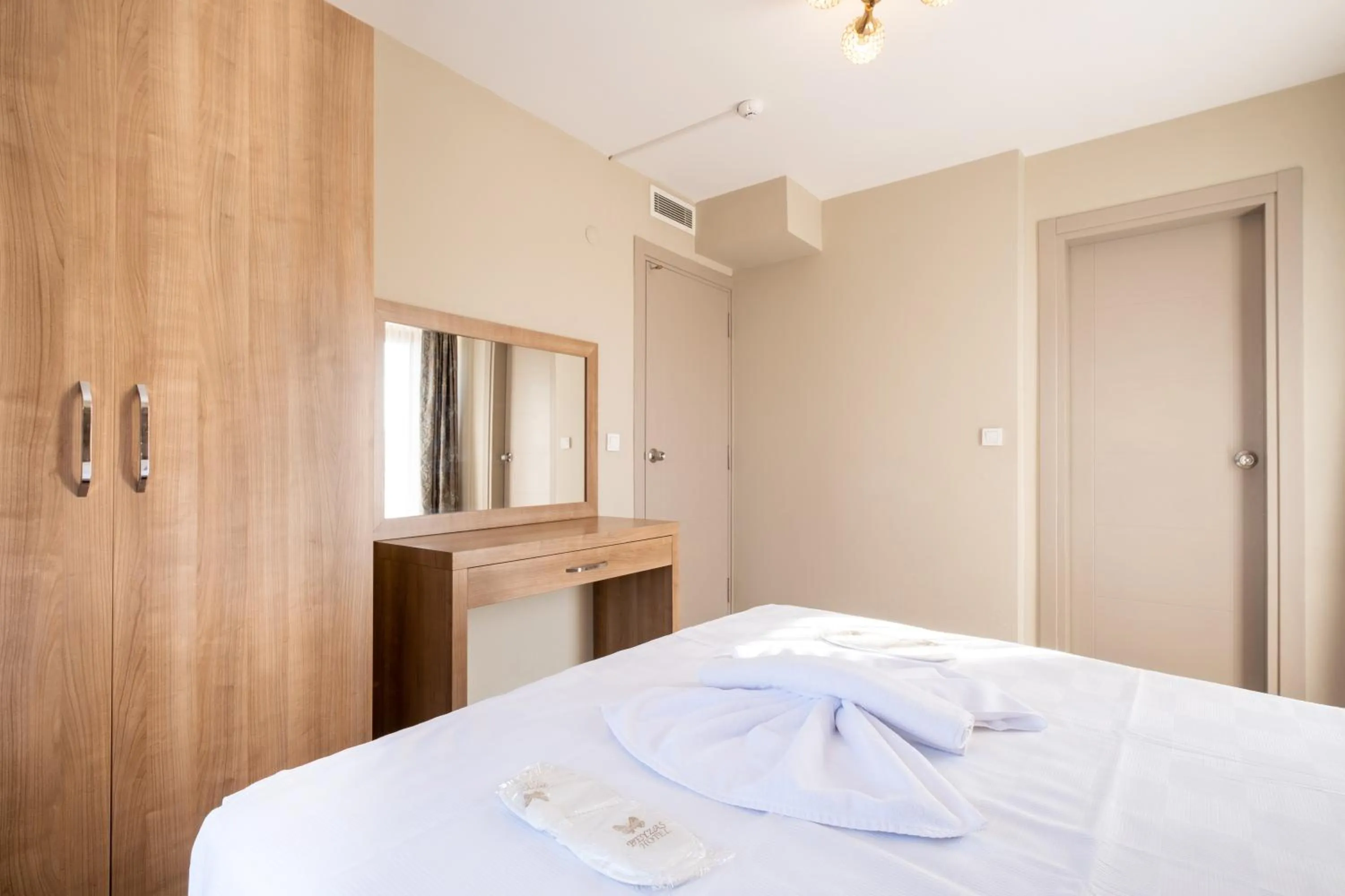 Bed in Lavin Hotel & Suites