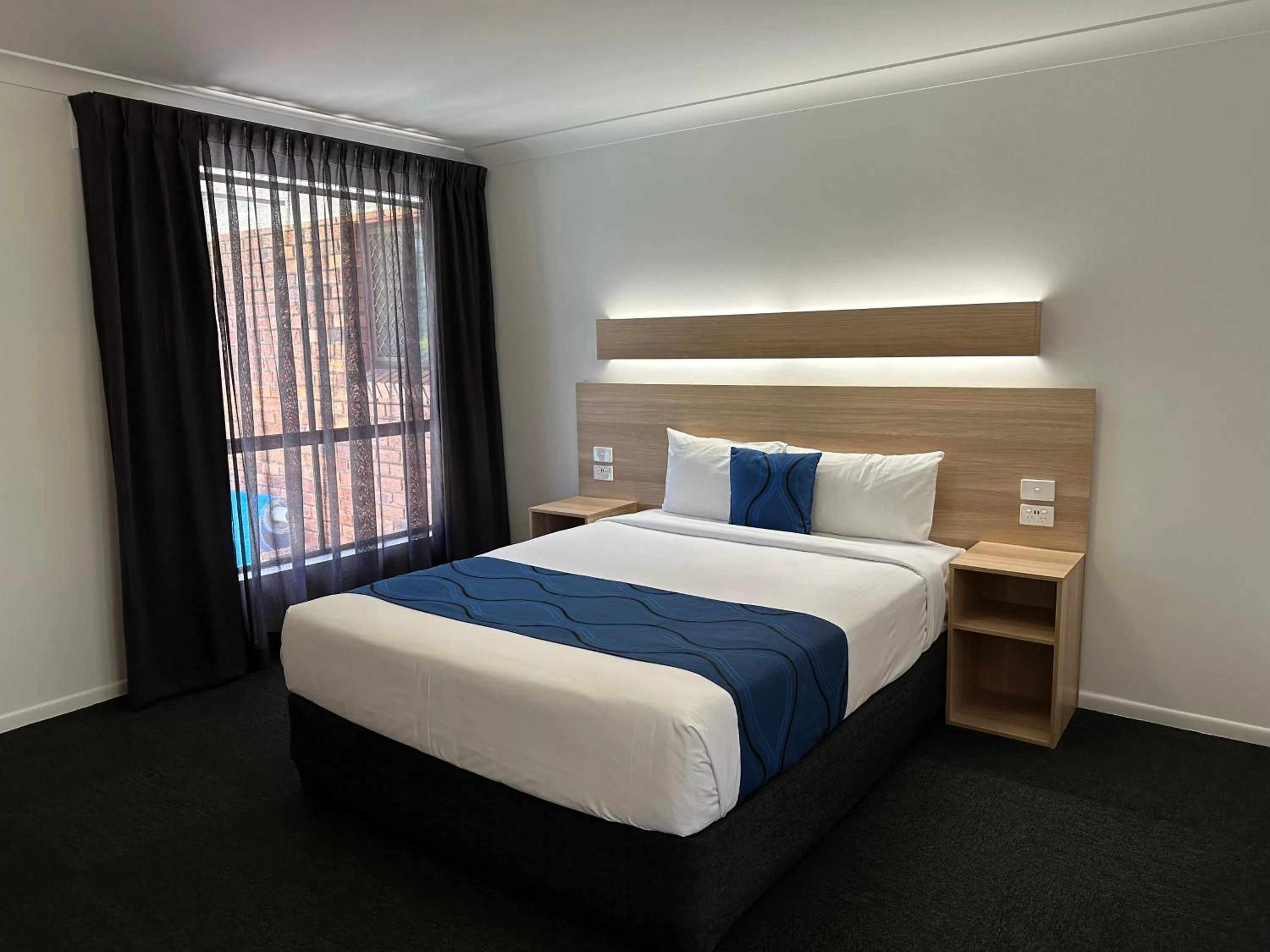 Bed in Logan City Motor Inn