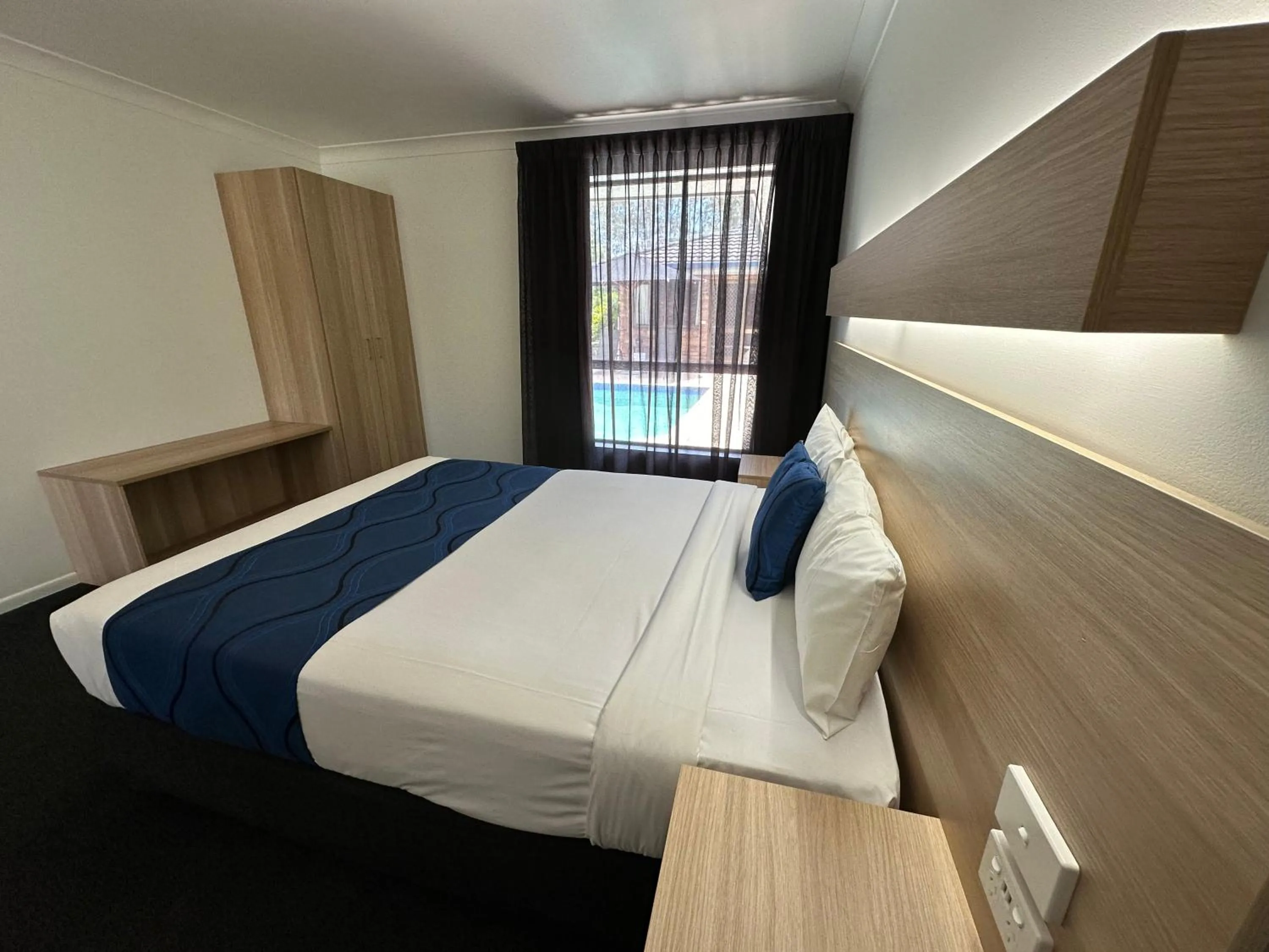 Bed in Logan City Motor Inn