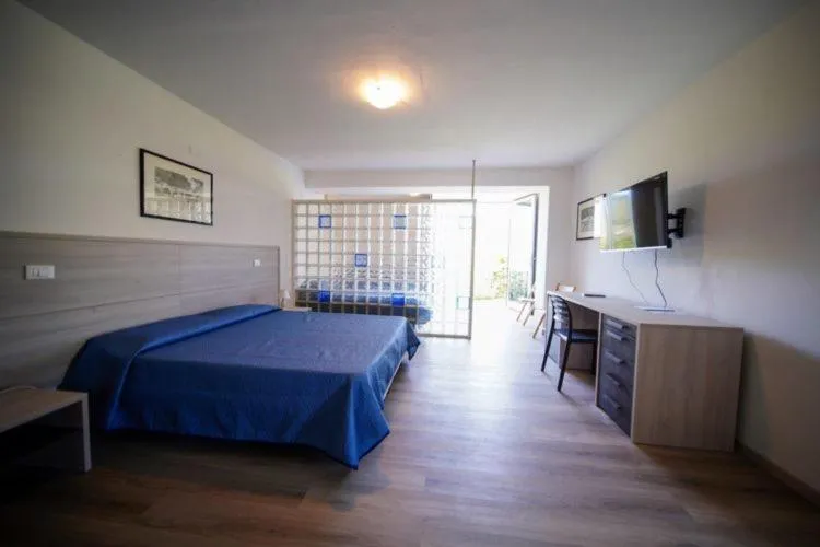 Photo of the whole room, Bed in Hotel Capo Di Stella