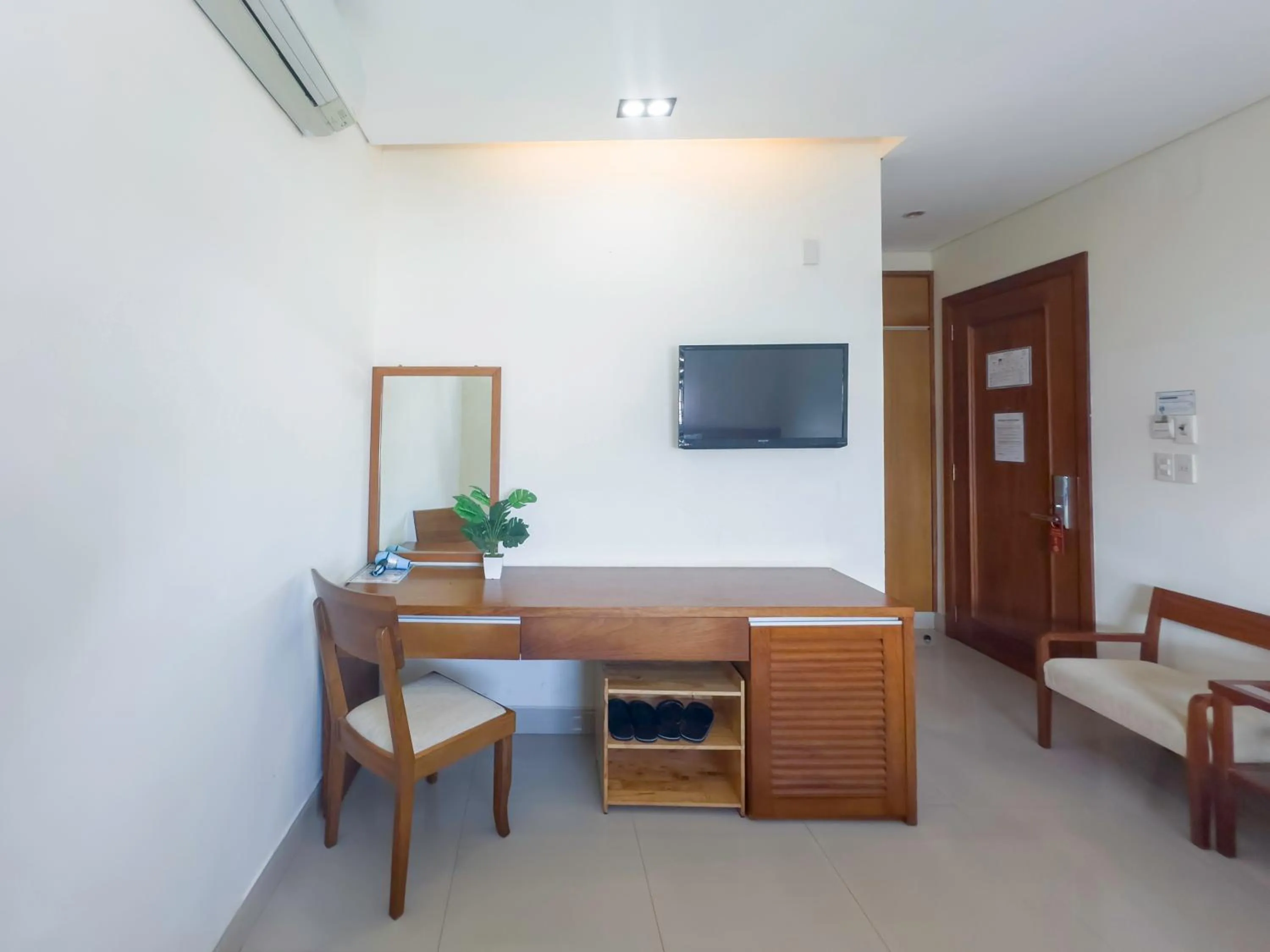 TV and multimedia in Doha Central Bliss Danang Hotel by Haviland