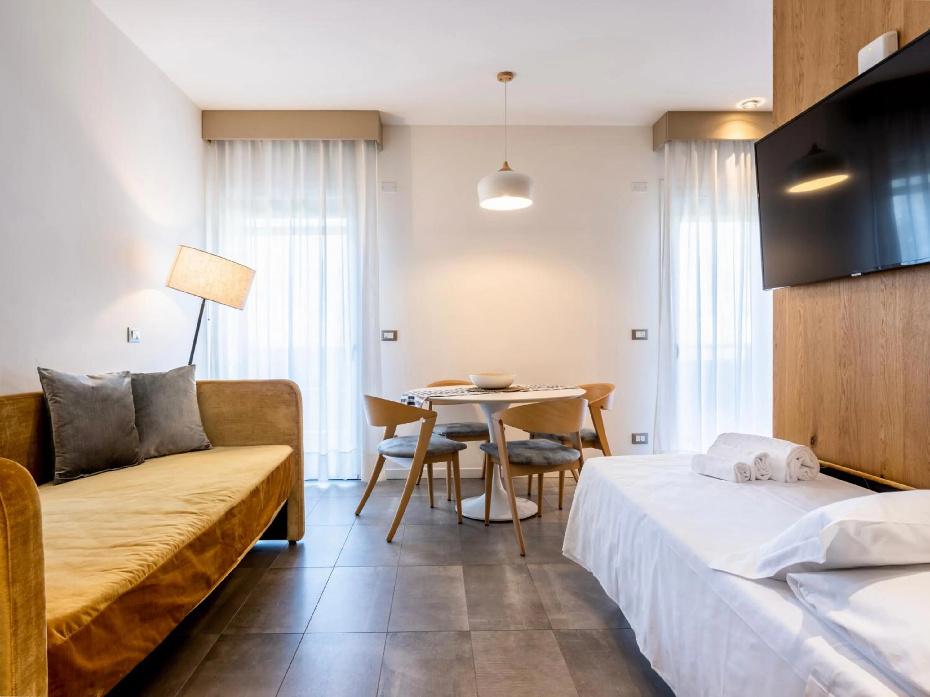 Living room, Bed in Venice Green Residence