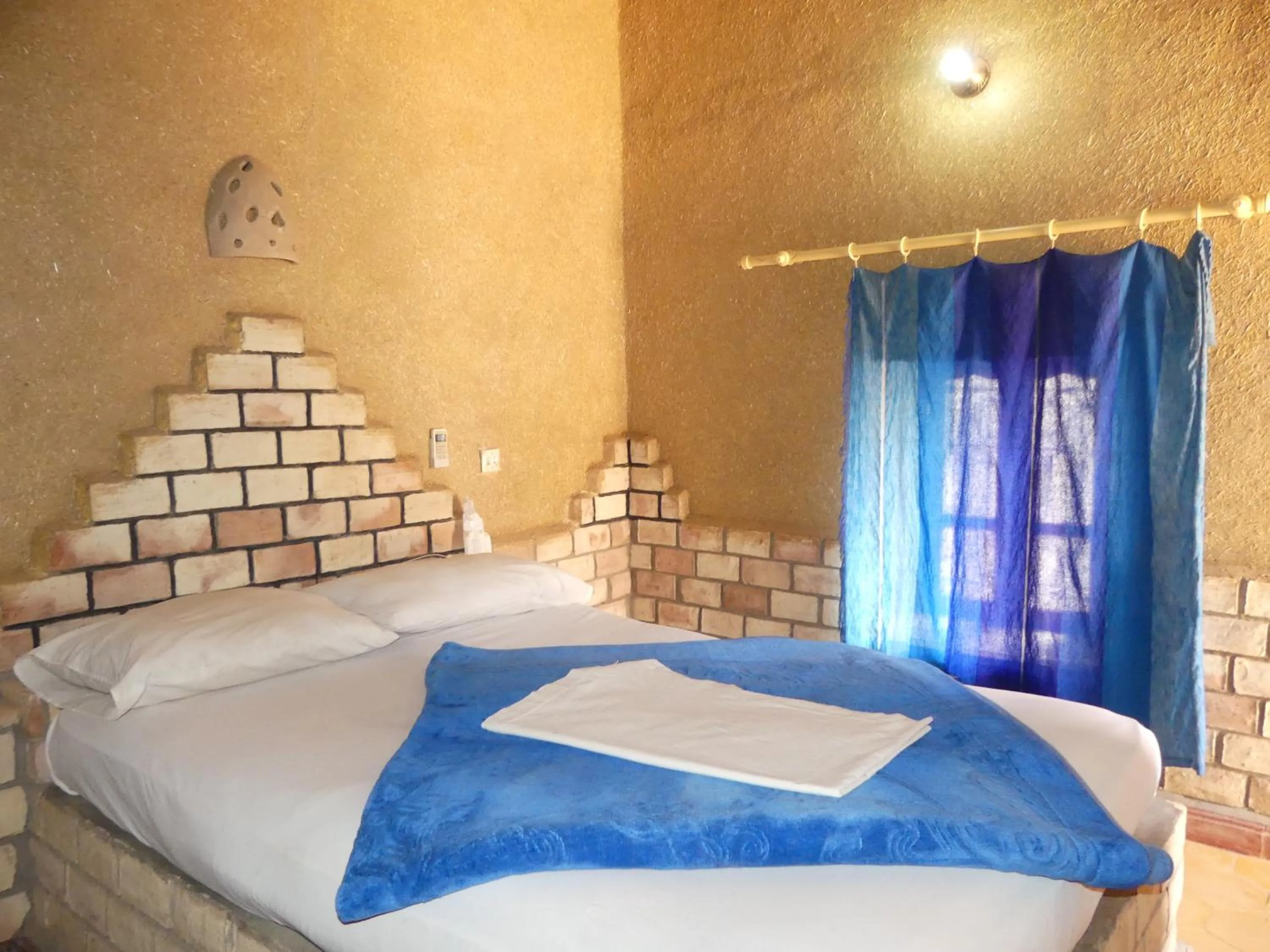 Bed in Les Pyramides Hotel Merzouga
