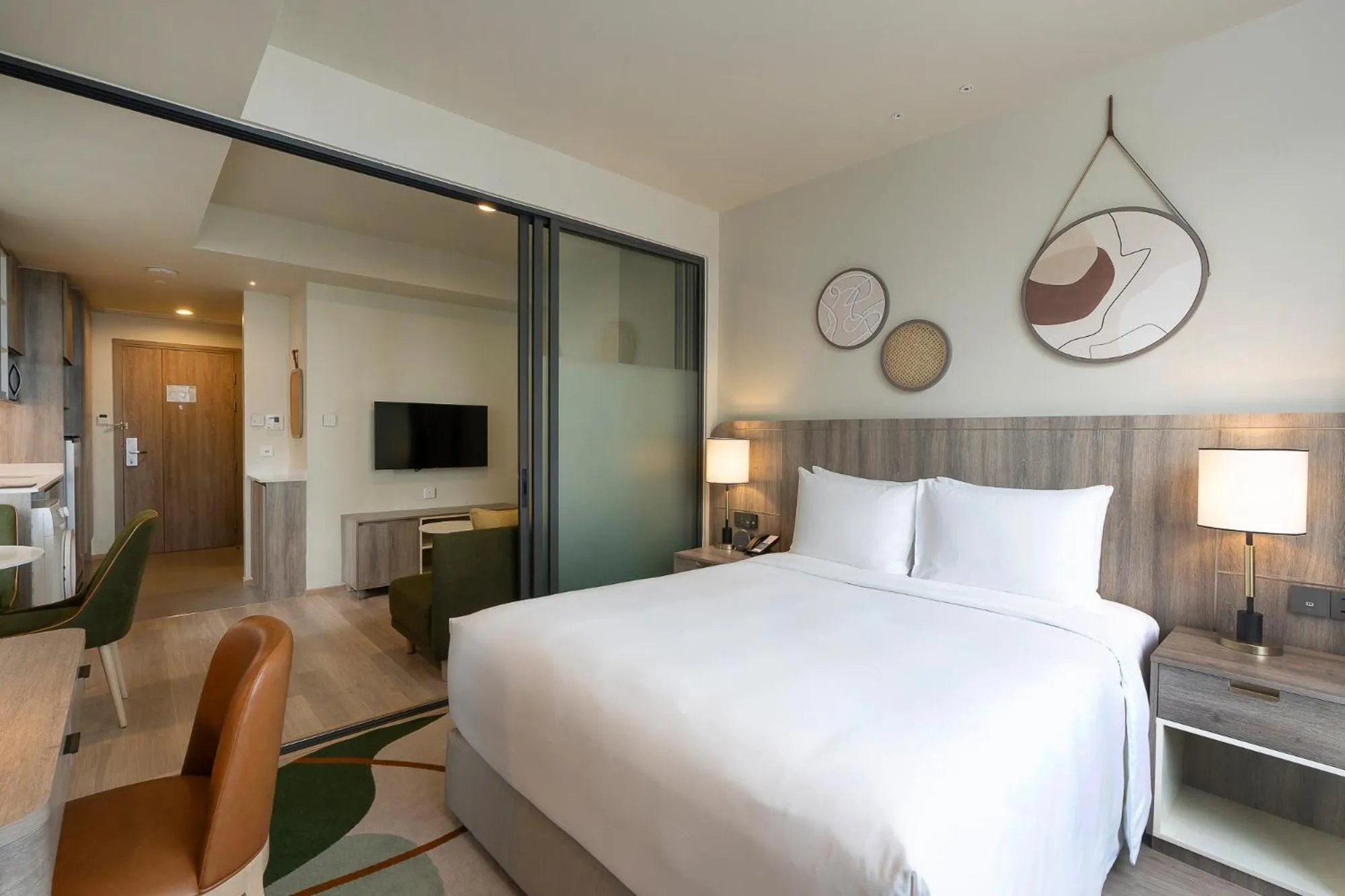 Communal lounge/ TV room, Bed in Staybridge Suites Bangkok Sukhumvit by IHG
