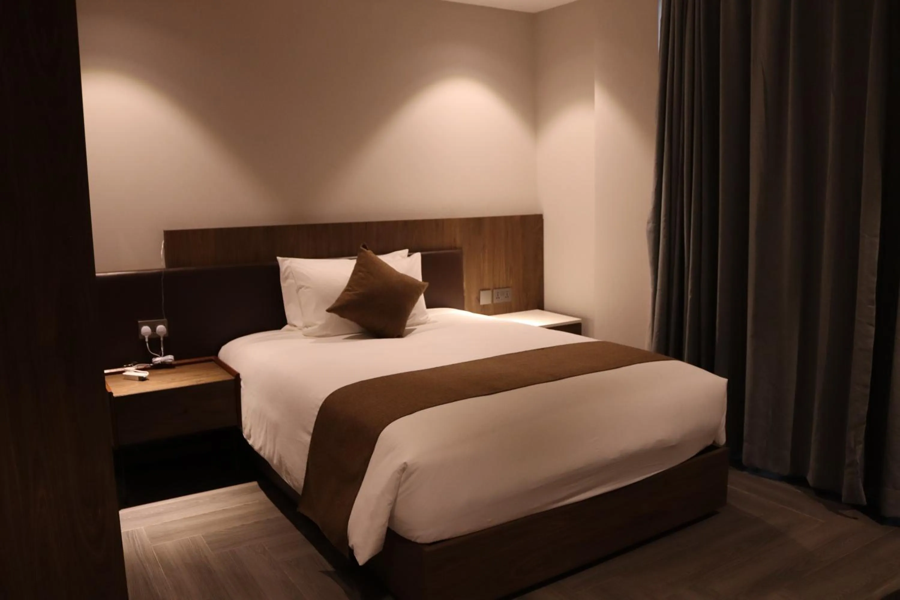 Bed in Zara Garden Hotel and Apartments