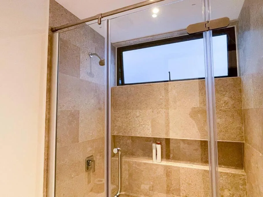 Bathroom in Ipana by Andiani Travel