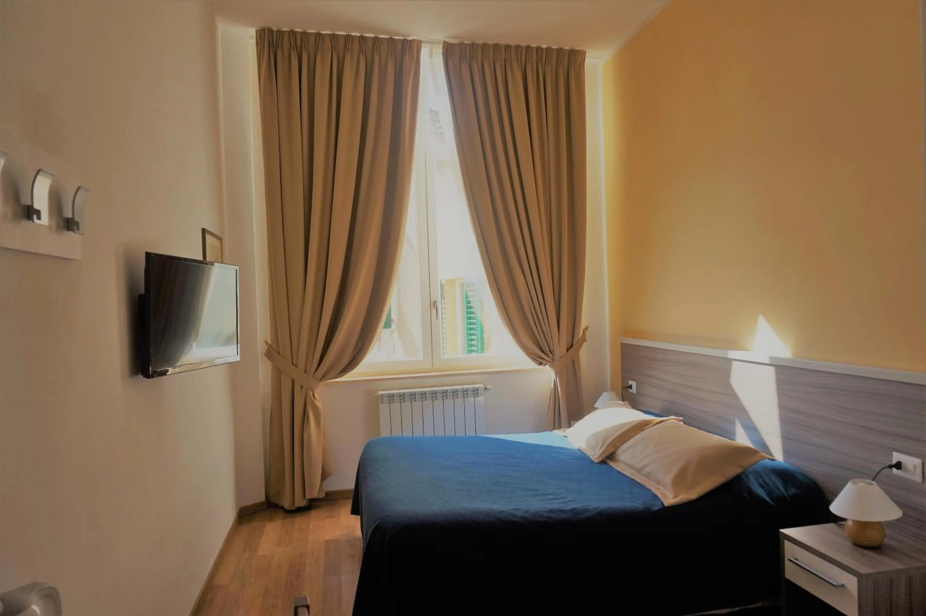 Bed in B&B I Tetti di Siena