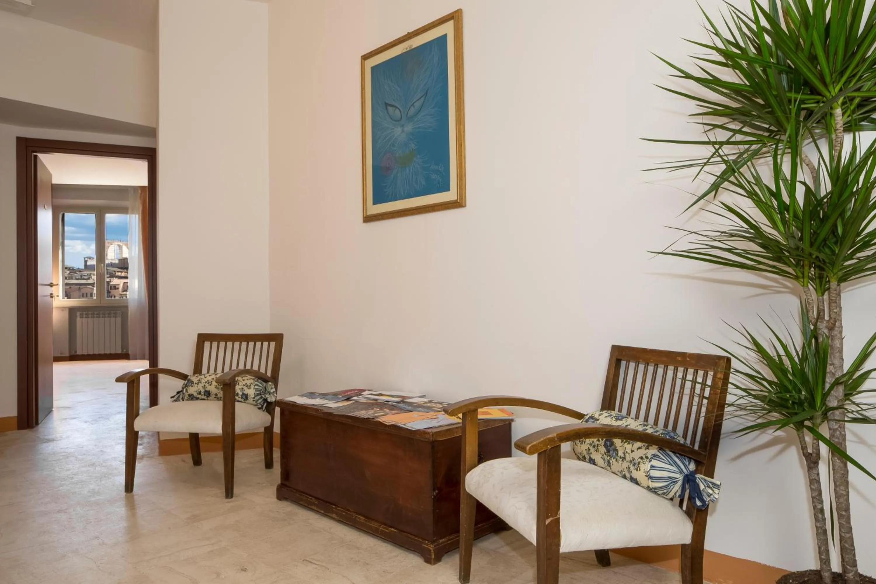 Communal lounge/ TV room in B&B I Tetti di Siena