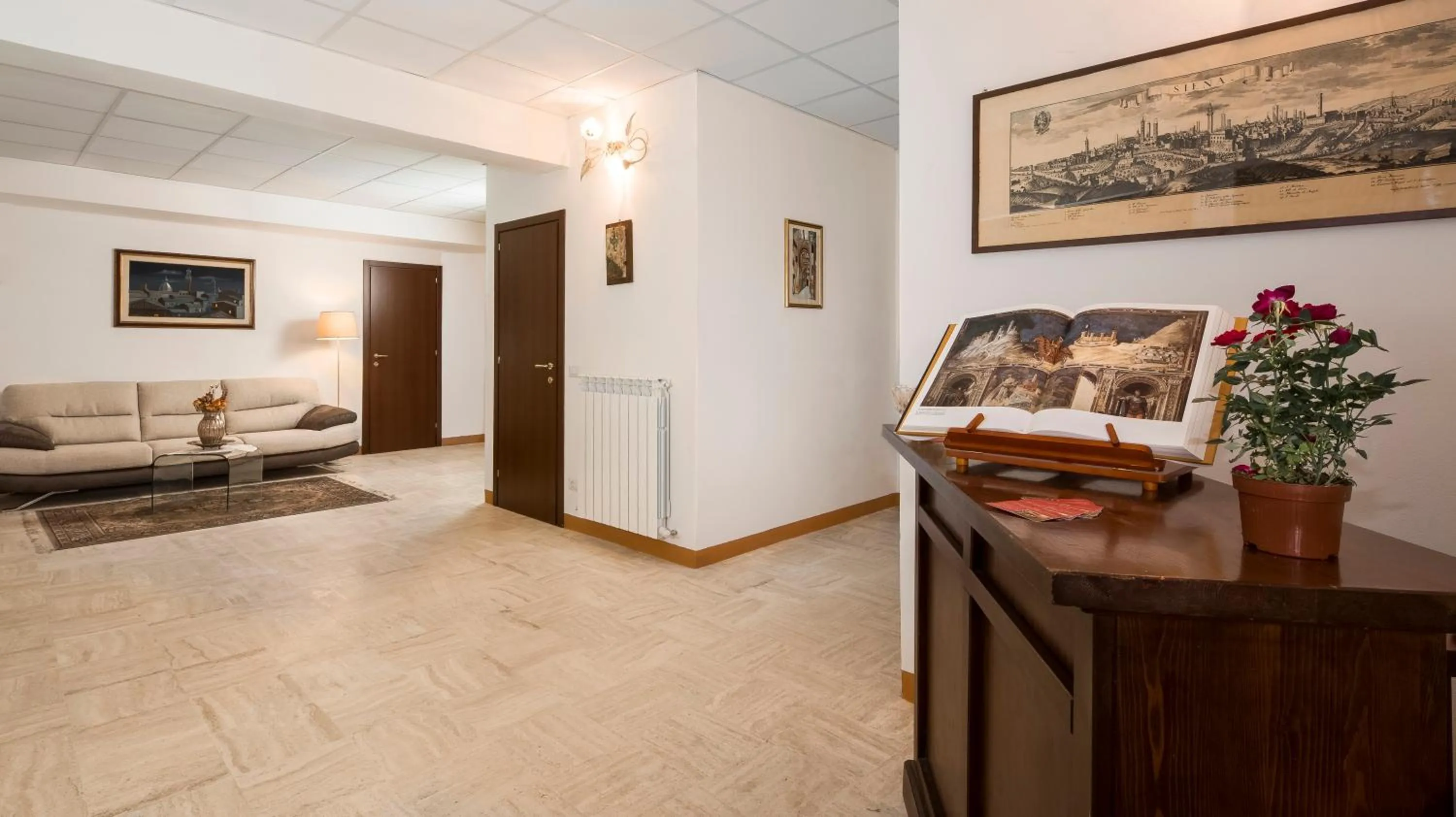 Communal lounge/ TV room in B&B I Tetti di Siena