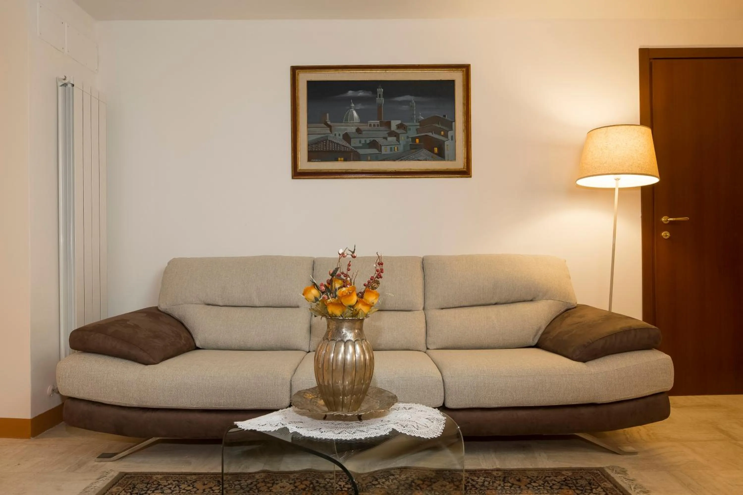 Communal lounge/ TV room in B&B I Tetti di Siena