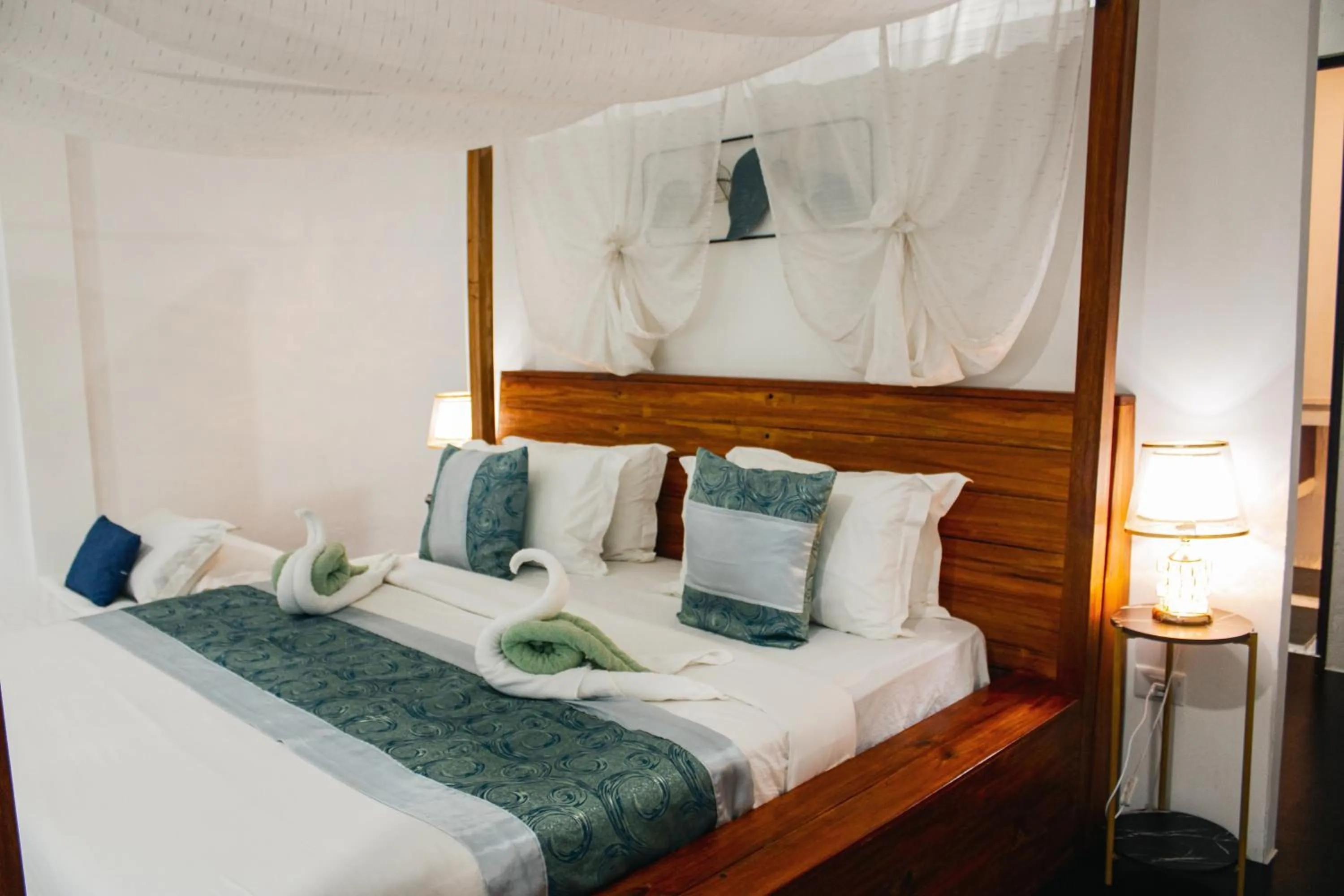 Bed in Carpe Diem Villas & Resort Dive & Stay resort