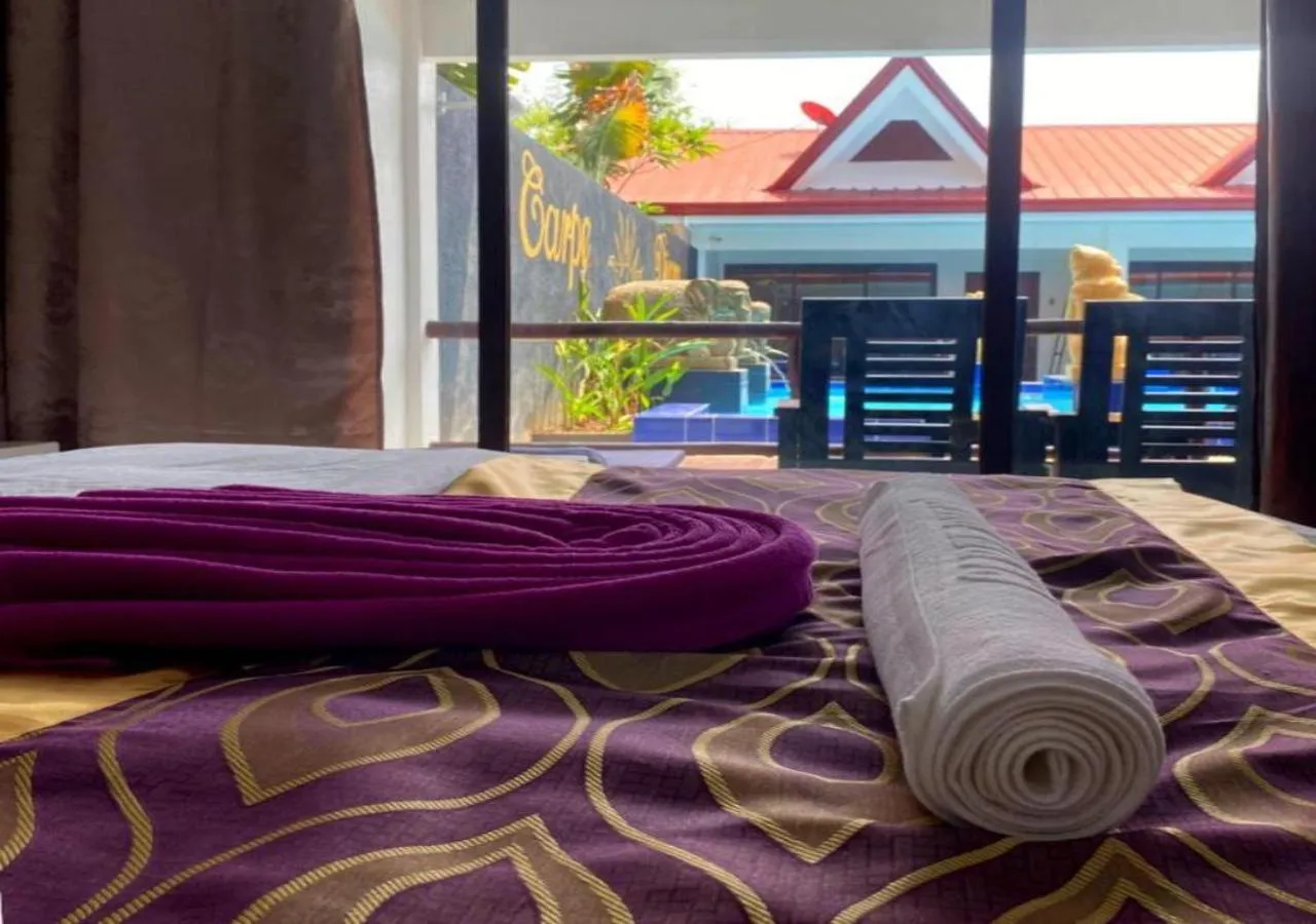 Bed in Carpe Diem Villas & Resort Dive & Stay resort