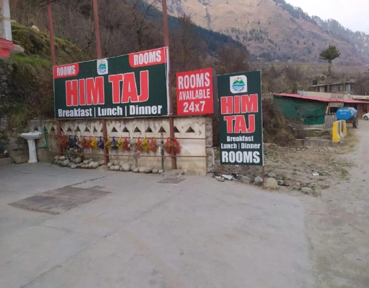 Property logo or sign in Him Taj by StayApart