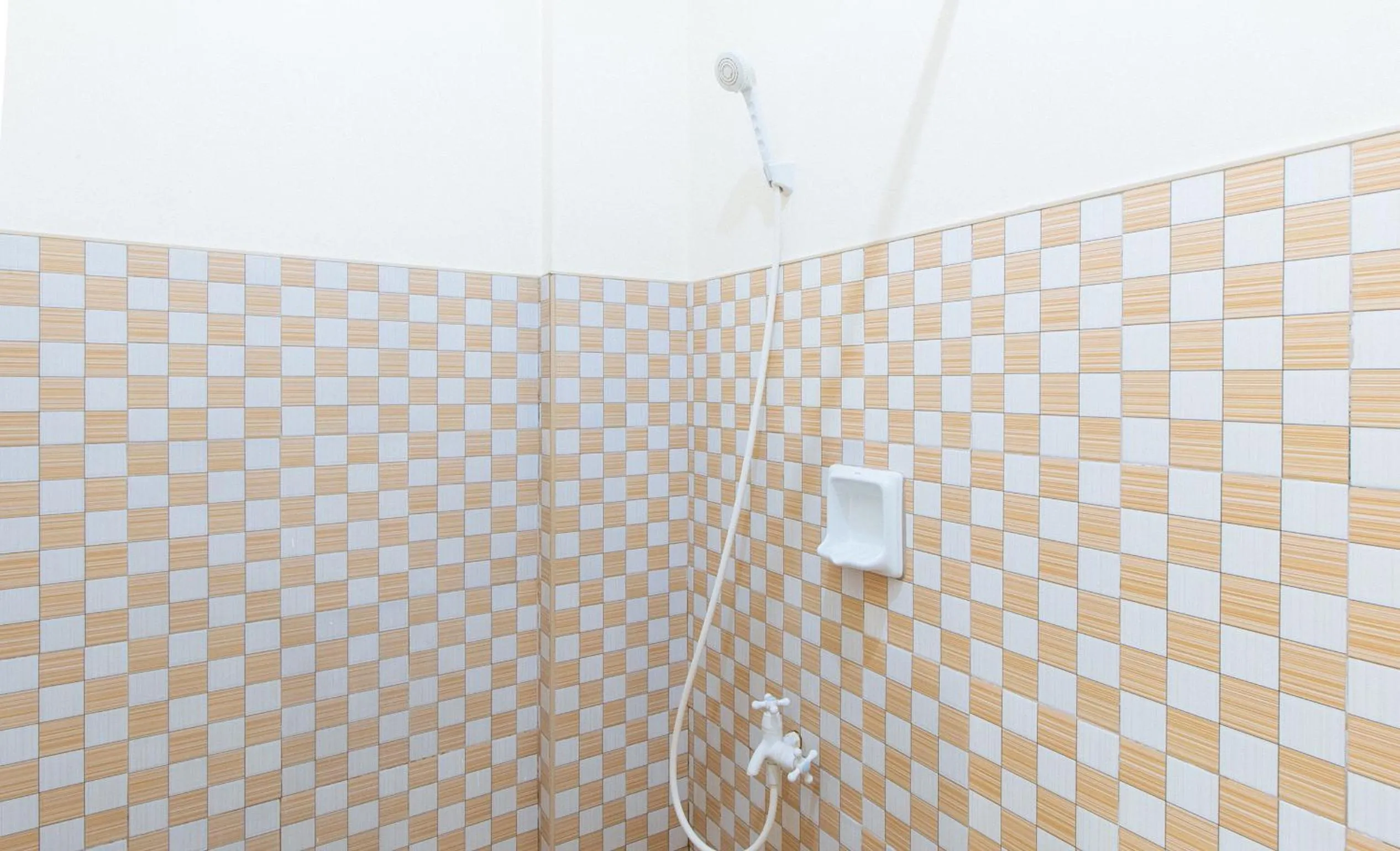 Shower in Golden Sunrise Hotel II by RedDoorz