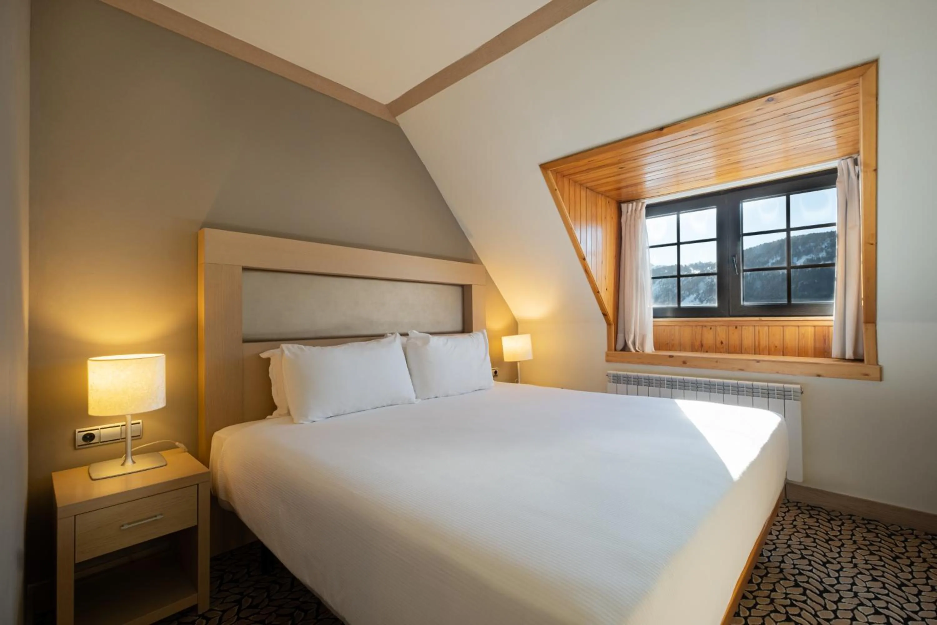 Bed in Eurostars Royal Tanau