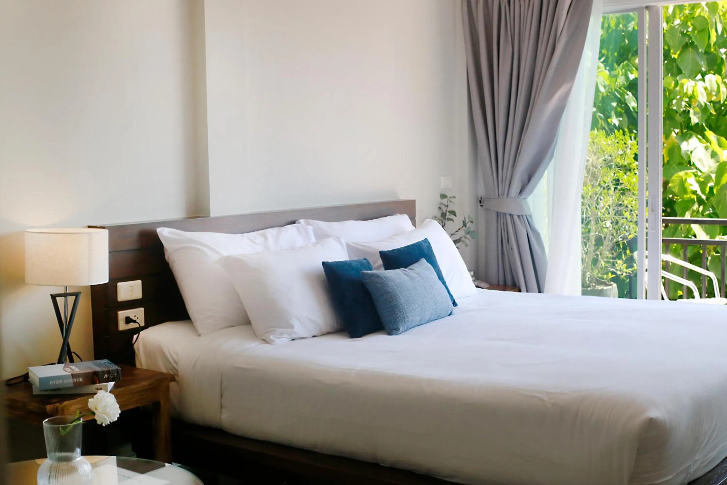 Bed in The Langstan Suites