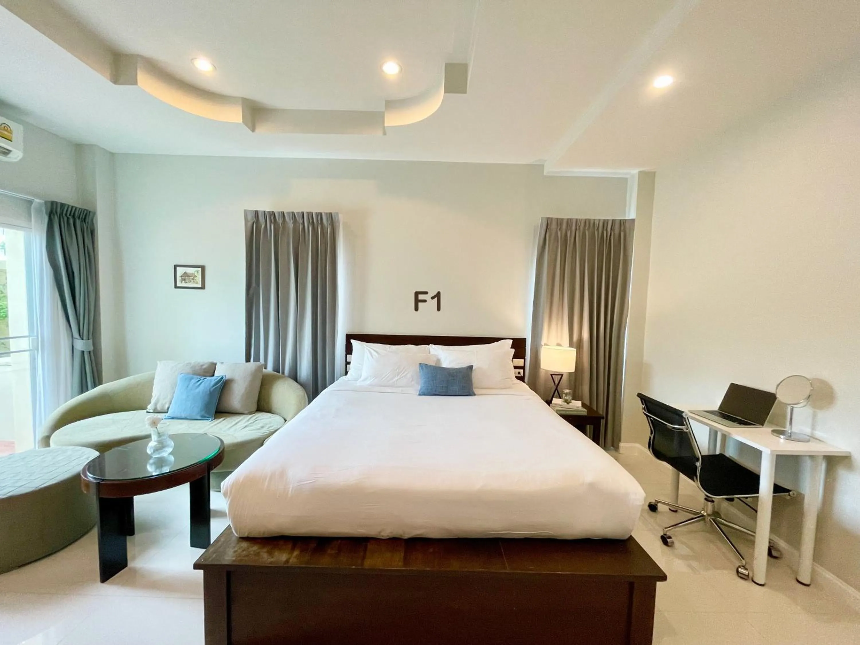 Bed in The Langstan Suites