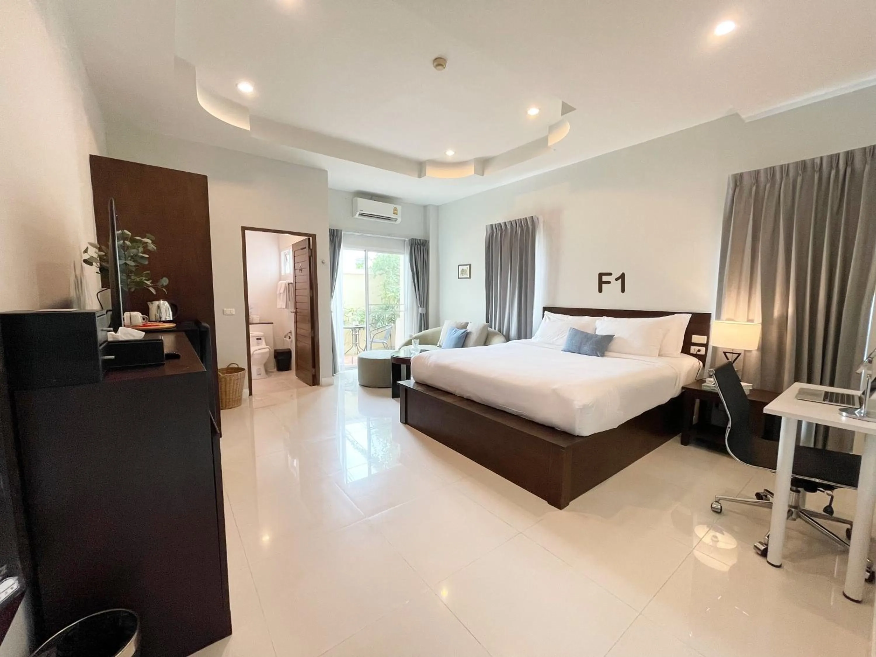 Bed in The Langstan Suites