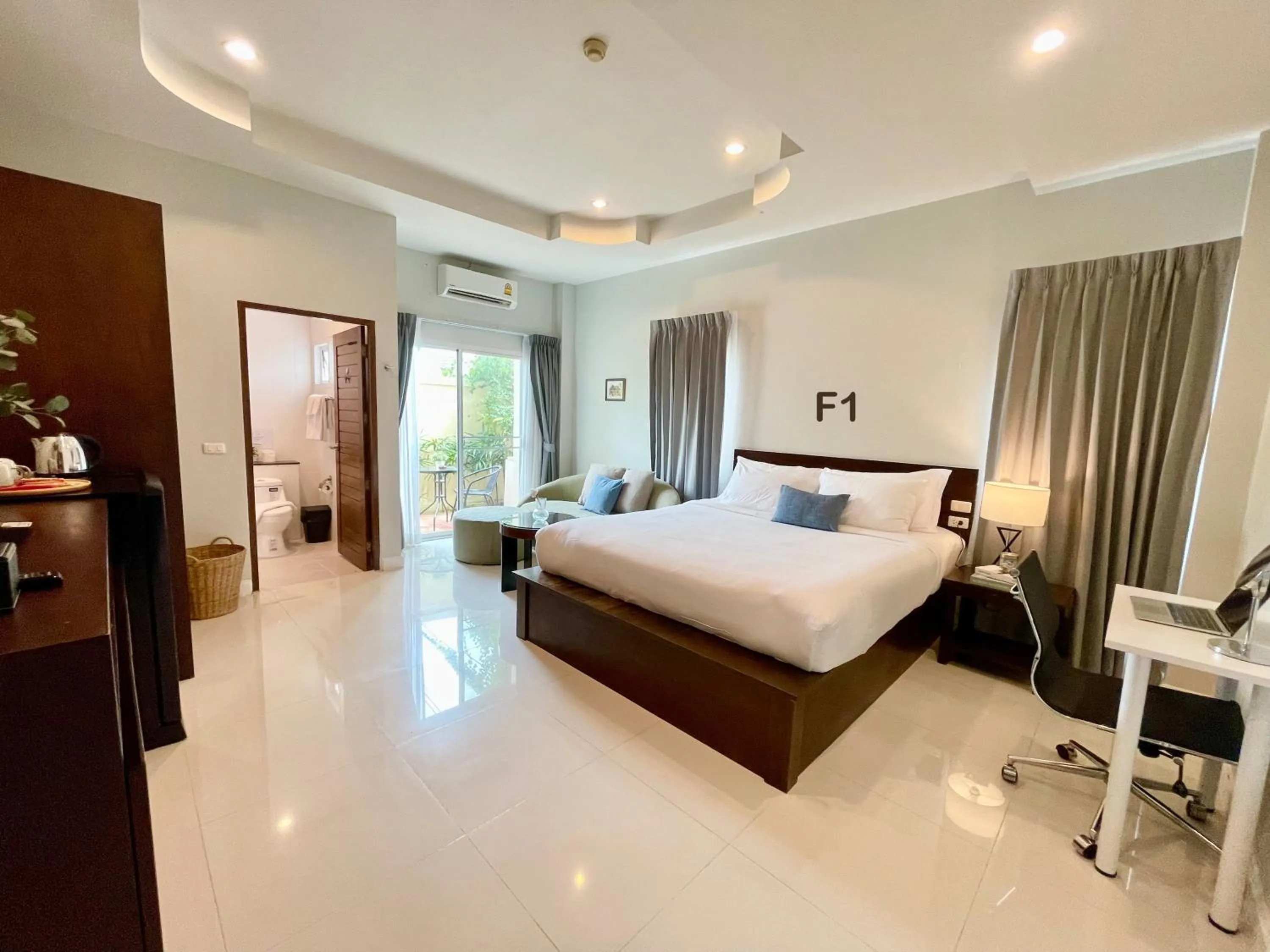 Bed in The Langstan Suites