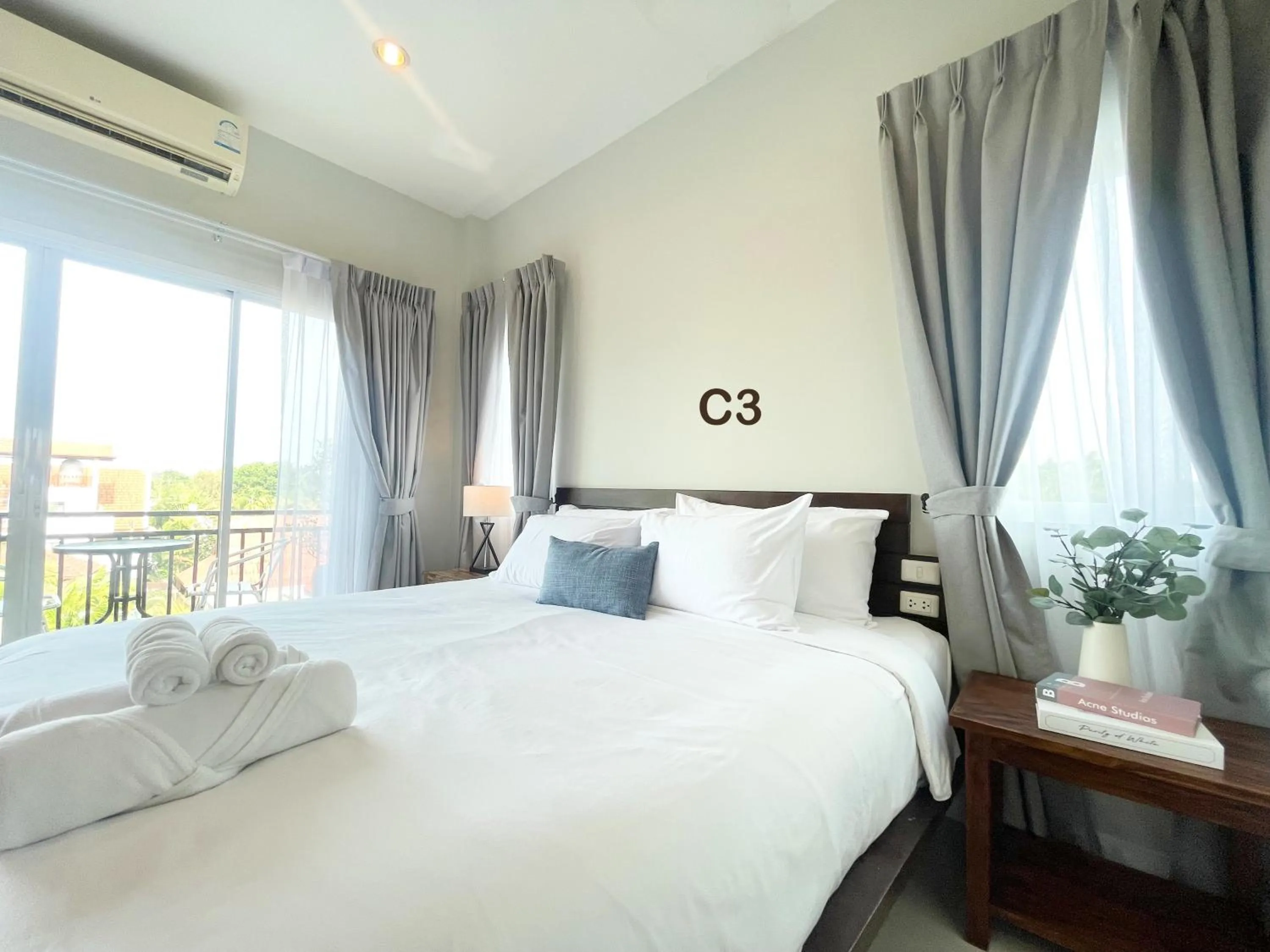 Bed in The Langstan Suites