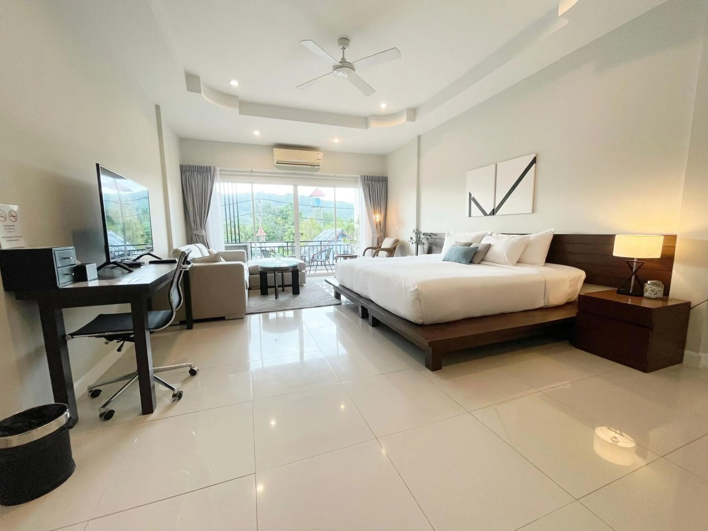 Bed in The Langstan Suites