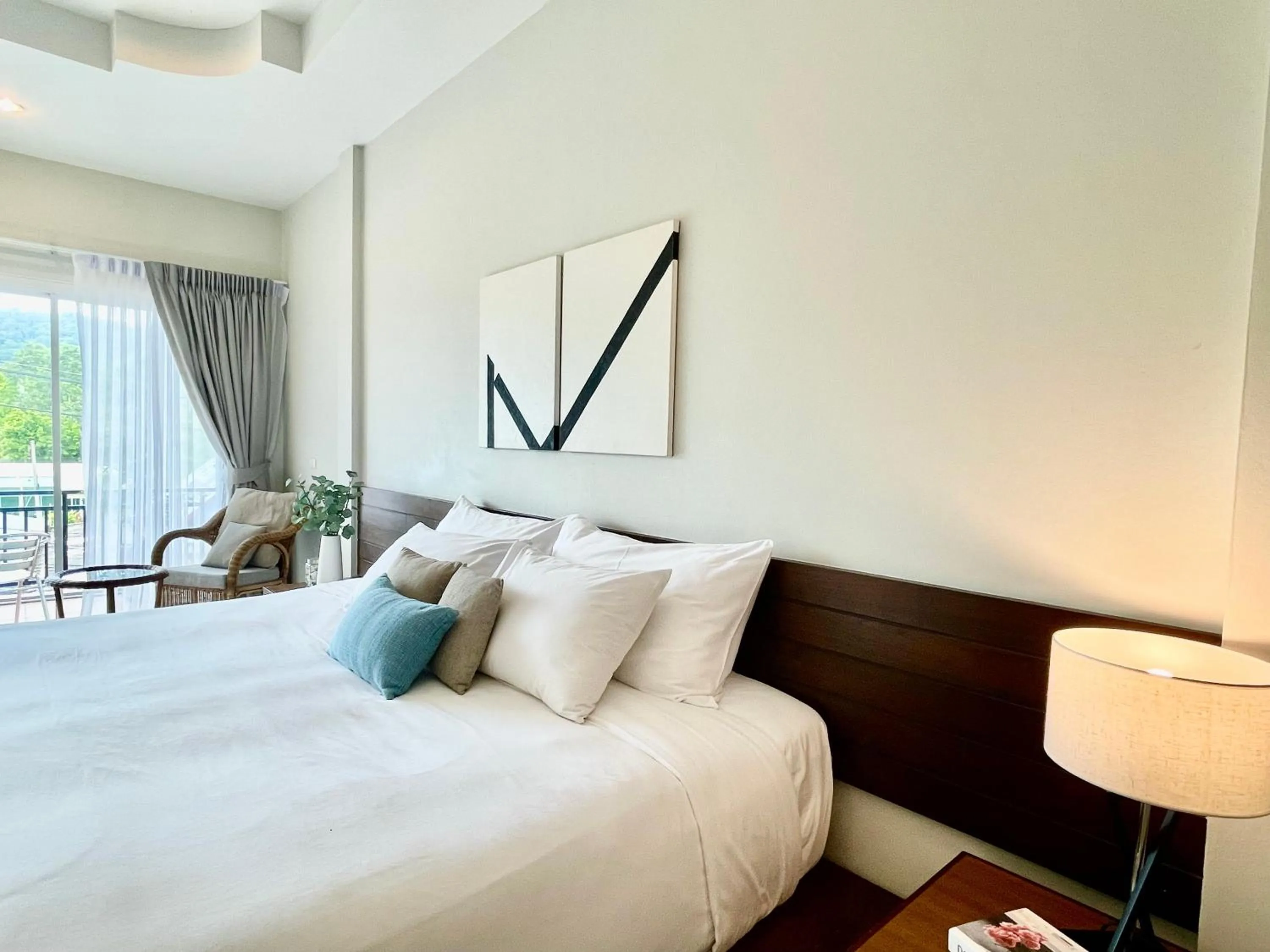 Bed in The Langstan Suites