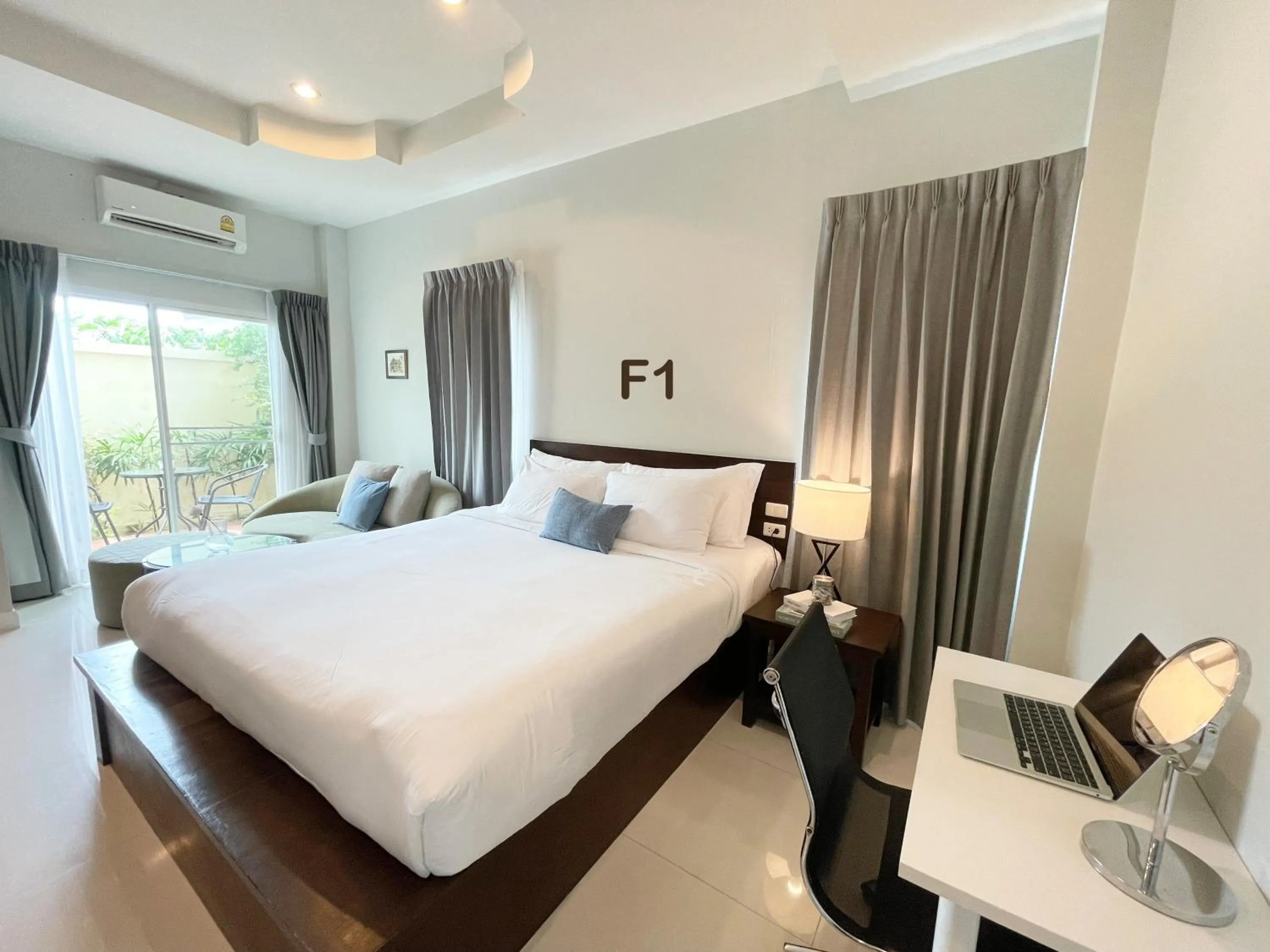 Bed in The Langstan Suites